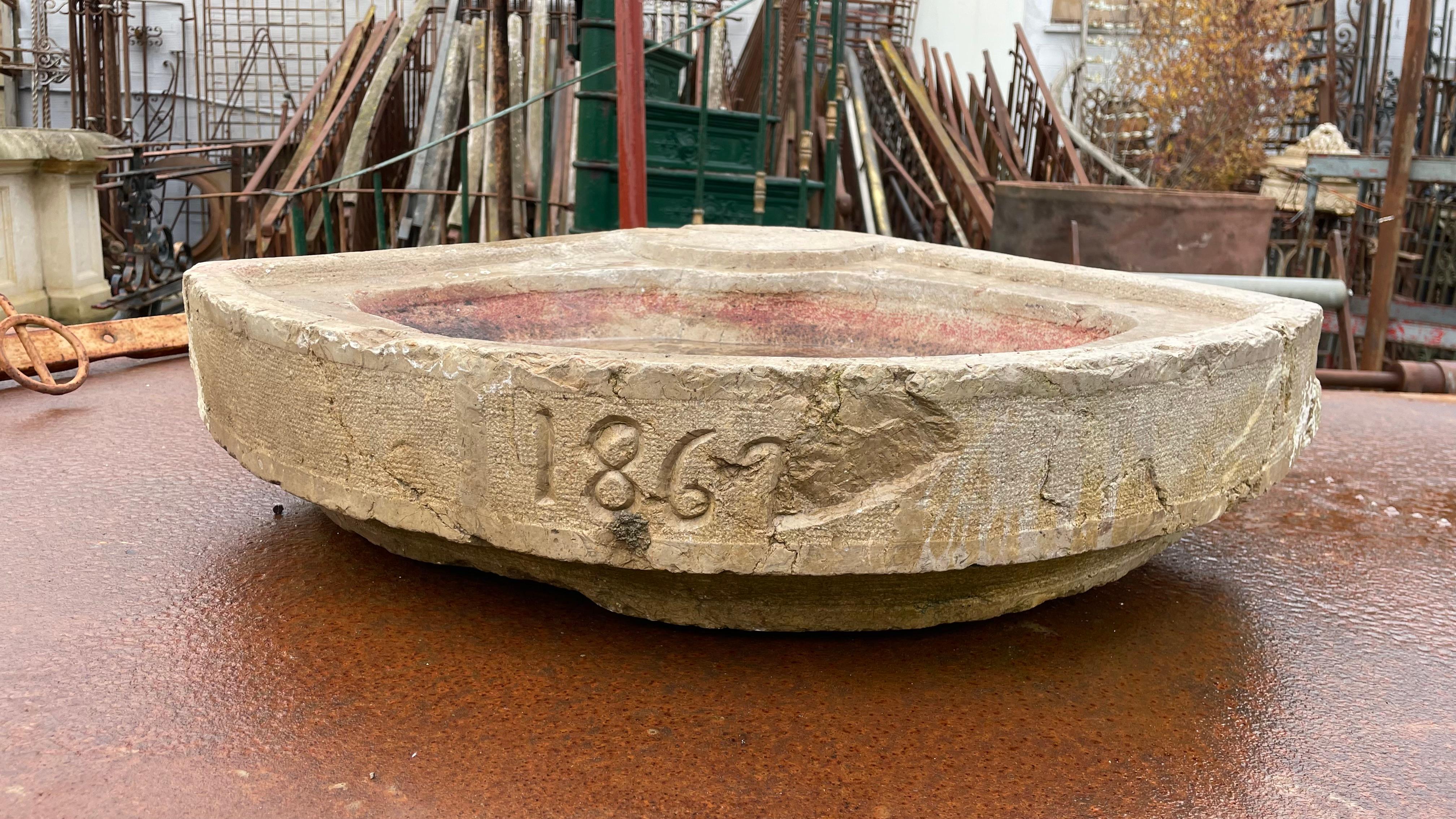19th Century Limestone Sink in an almost triangular shape. Date carved at the front.