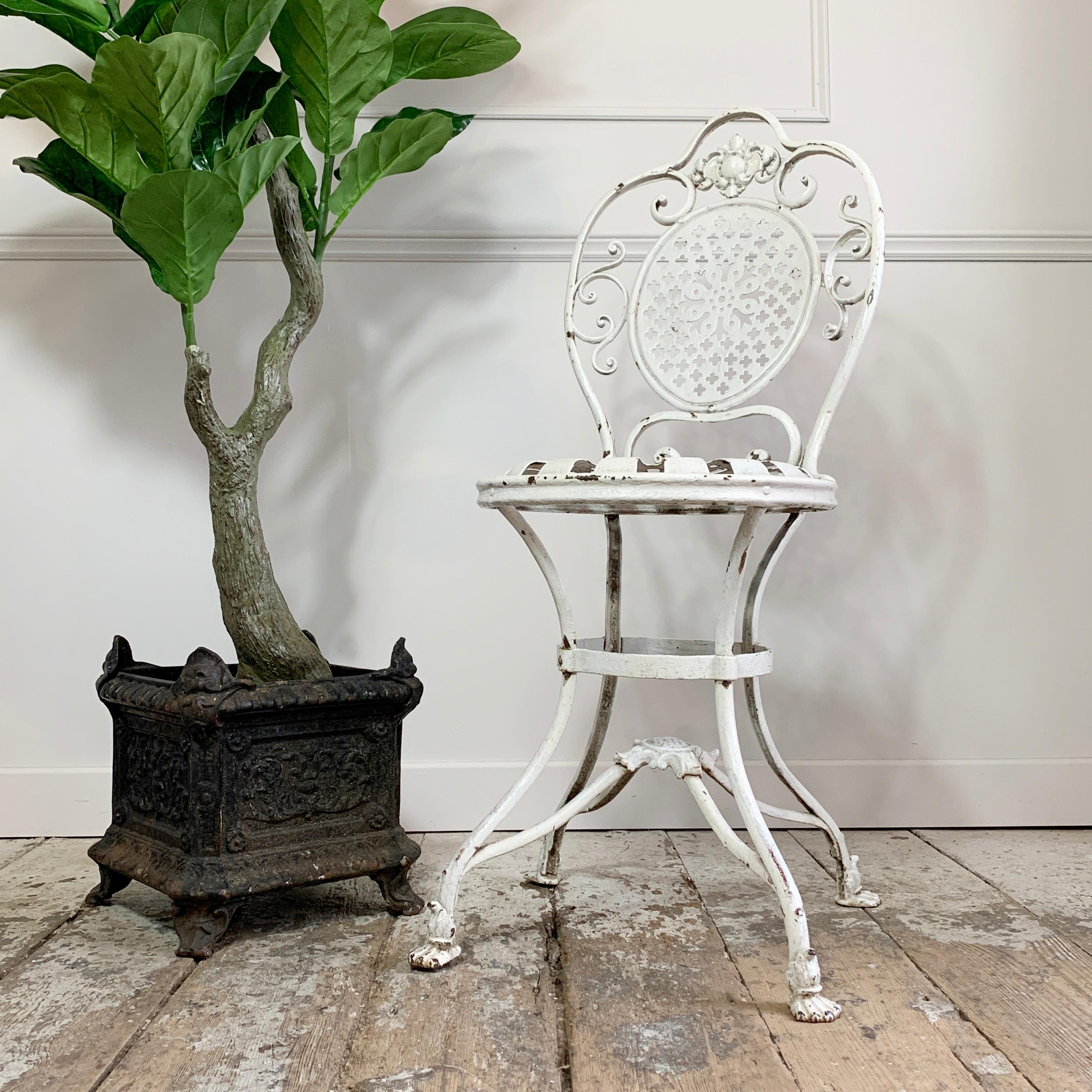 An absolutely stunning Arras Orangery chair, the highly decorative and detailed piece is in exceptional antique condition. This is the early original Arras model, bearing the Lions Paw feet, so dates to circa 1880. The elegant decorative, raise seat