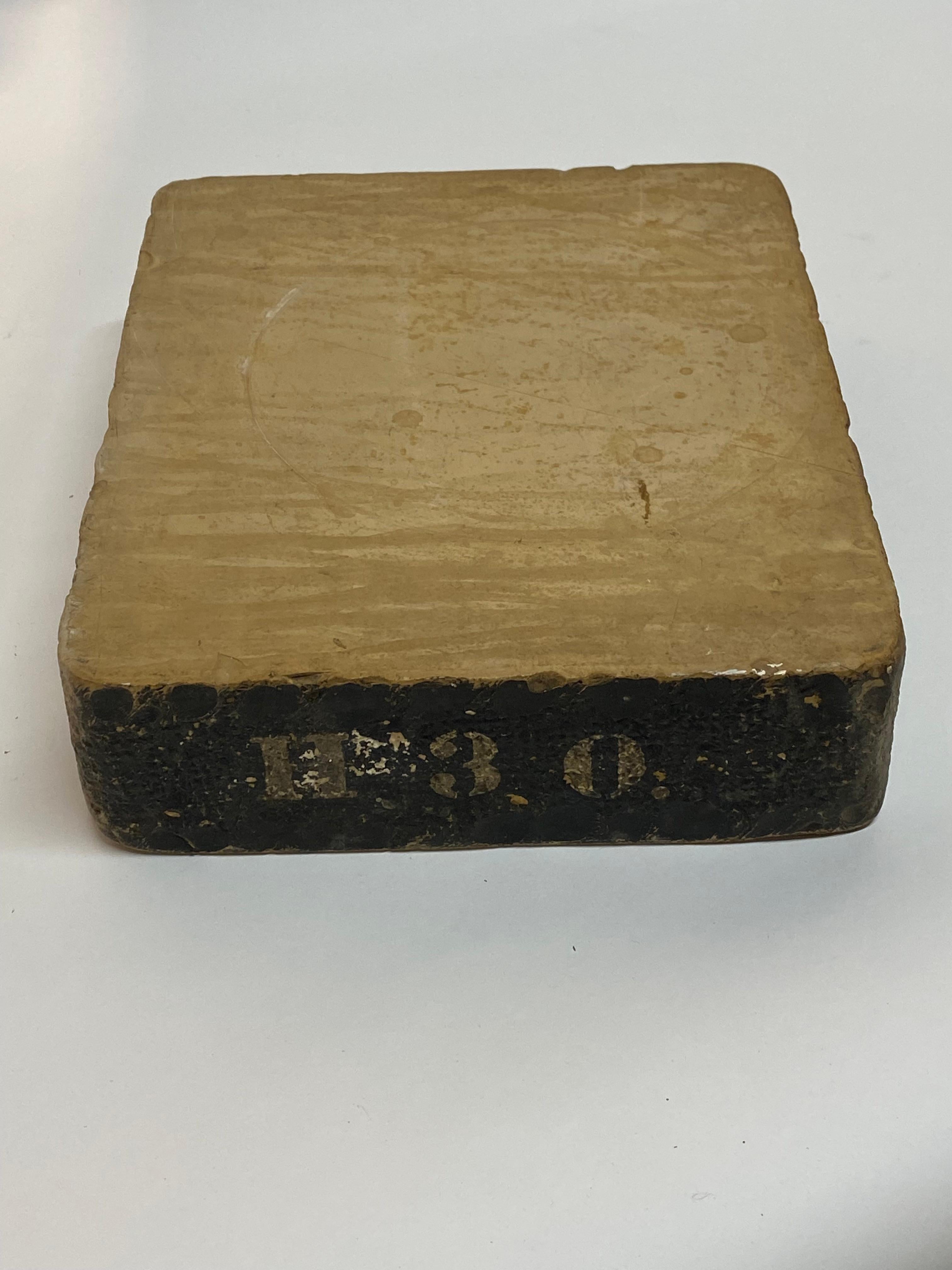 Nineteenth Century solid limestone lithographers stone. Two smooth printing surfaces with a rough exterior. Stenciled graphics on the edge, H 3 0. Limestone was used more commonly than glass, granite or marble because it was less likely to dull a
