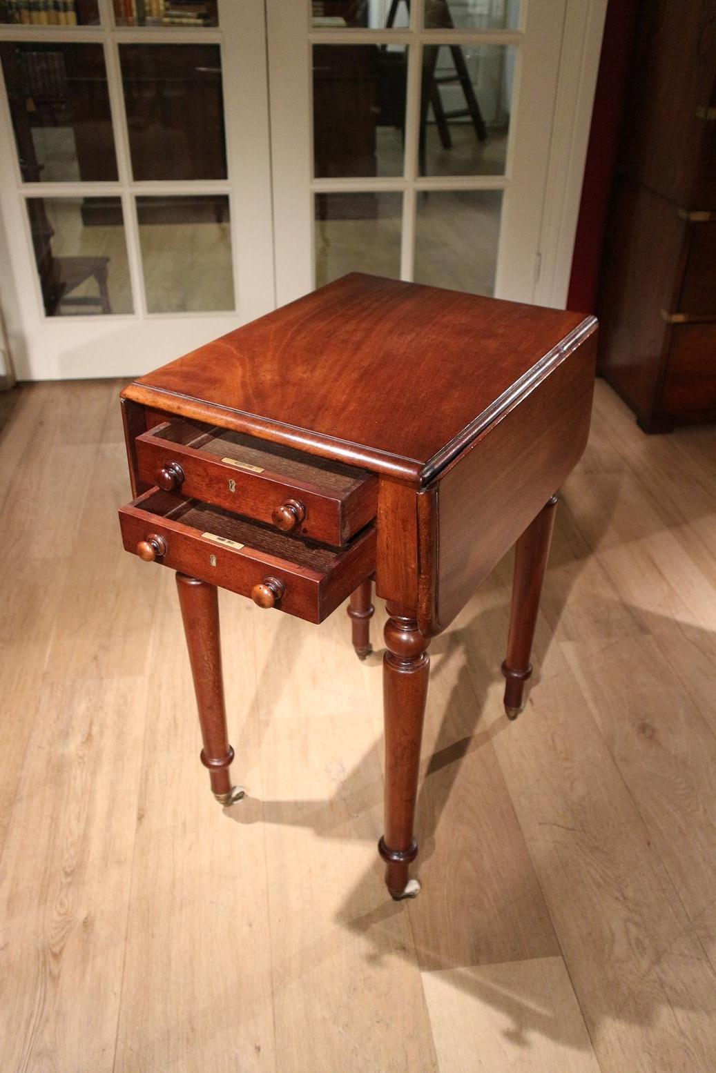 Beautiful little mahogany pembroke table with 2 drawers. Stands on brass wheels. Table is in perfect condition and top quality.
Origin: England
Period: circa 1840
Size: Br. 20-36-20, D  50cm, H 72cm.