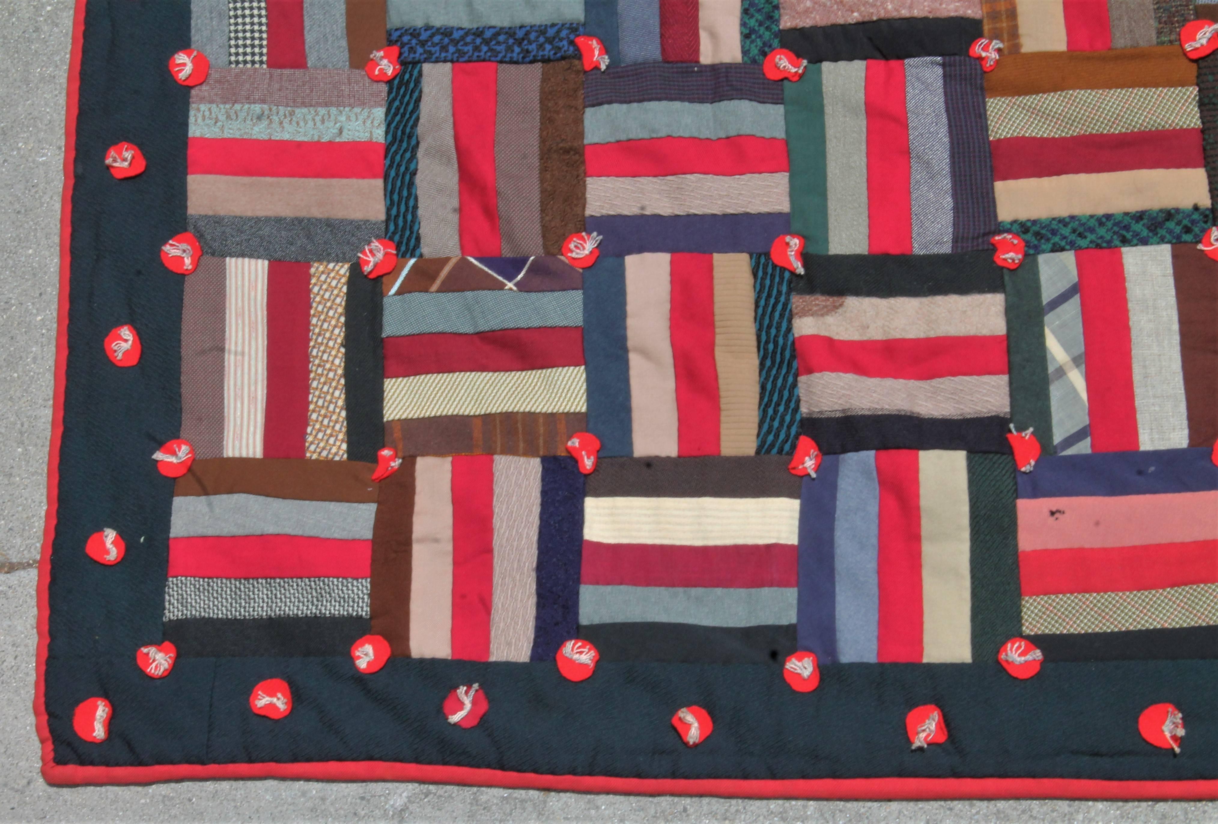 This wool tied log cabin quilt is in fine condition and has a wonderful floral backing in cotton sateen. It was found in Pennsylvania. It has little button ties through out. Great colors.