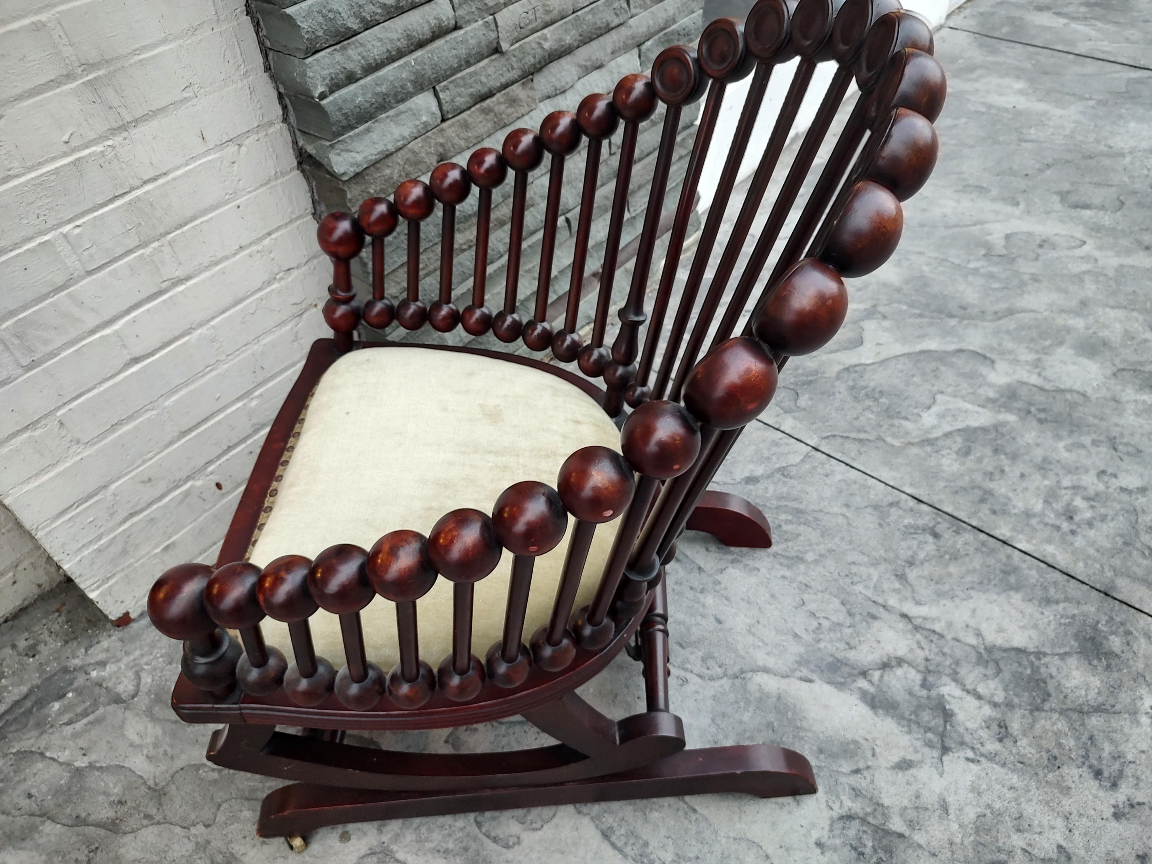 Spectacular lollipop platform rocker in mahogany by George Hunzinger. Late 19thc creation that is still relevant today. Seat has a spring system as well as being padded. This chair is in excellent original unrestored antique condition with no