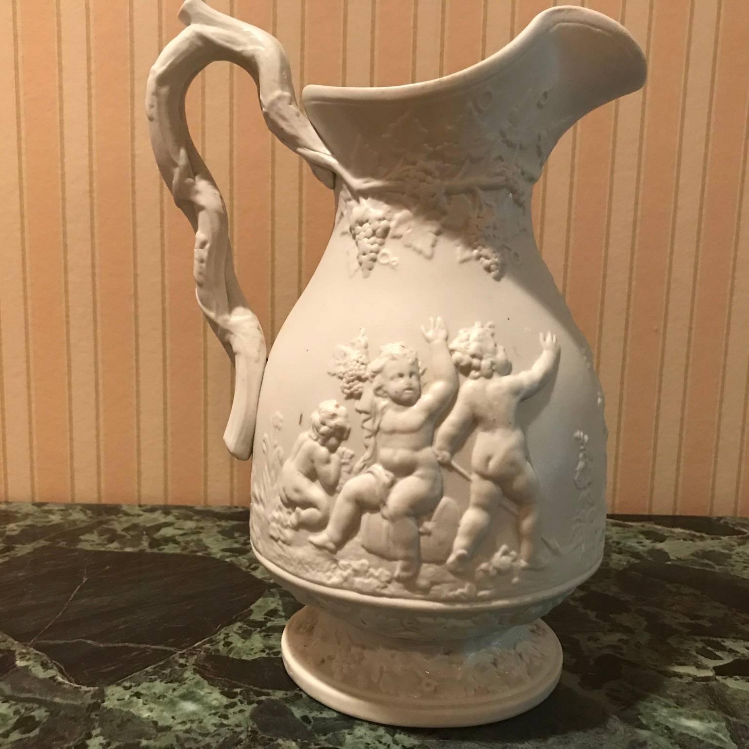 19th Century Lot of Four Porcelain Relief Pitchers For Sale 6