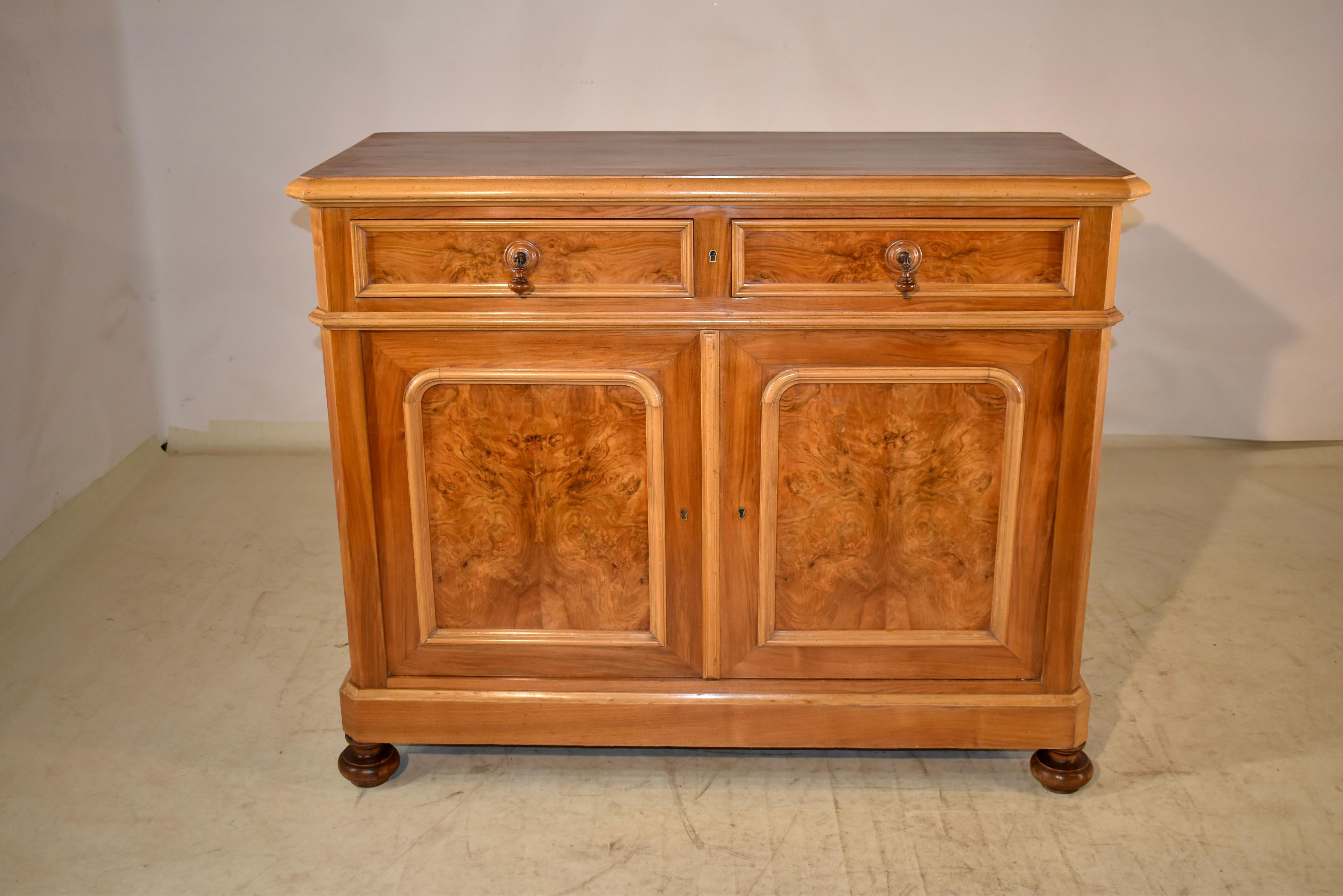 Unusual and wonderful 19th century Louis Philippe buffet made from several different woods for gorgeous contrasting detail. The entire case is made from spectacular rosewood. The top is banded in maple with a shaped and beveled edge. The sides of