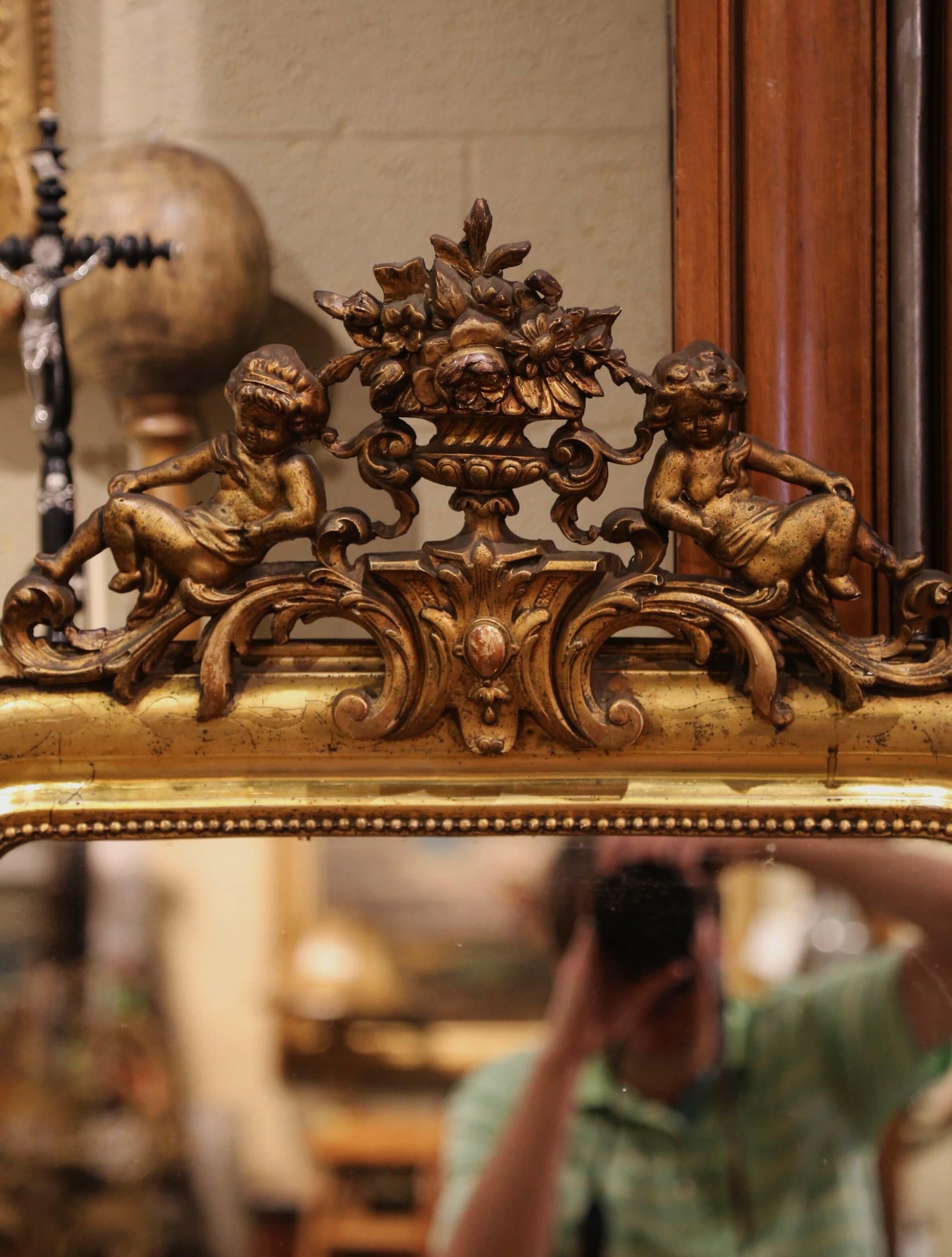 French 19th Century Louis Philippe Carved Giltwood Mirror with Cherub and Floral Motifs For Sale