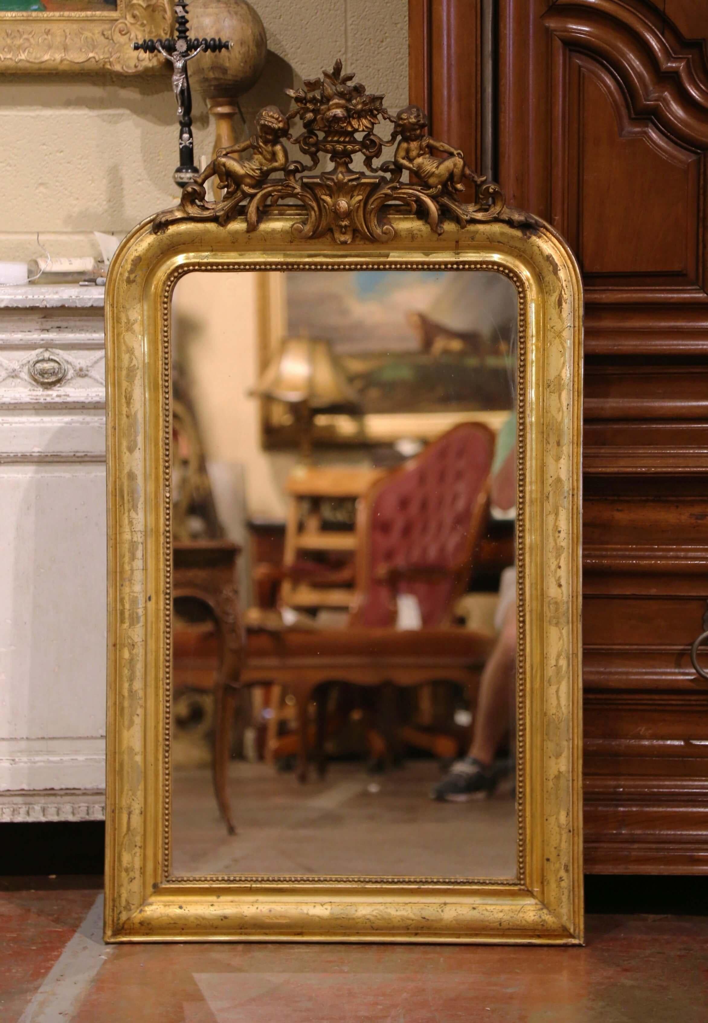 Hand-Carved 19th Century Louis Philippe Carved Giltwood Mirror with Cherub and Floral Motifs For Sale