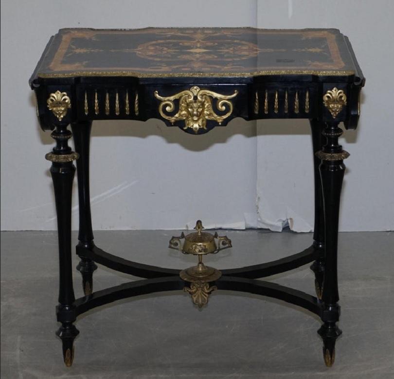 We are delighted to offer for sale this stunning original 19th century Louis Philippe Ebonised & Marquetry inlaid writing table with extending side leaves and gilt bronze fixtures and fittings 

A very fine table, made from luxury amboyna and