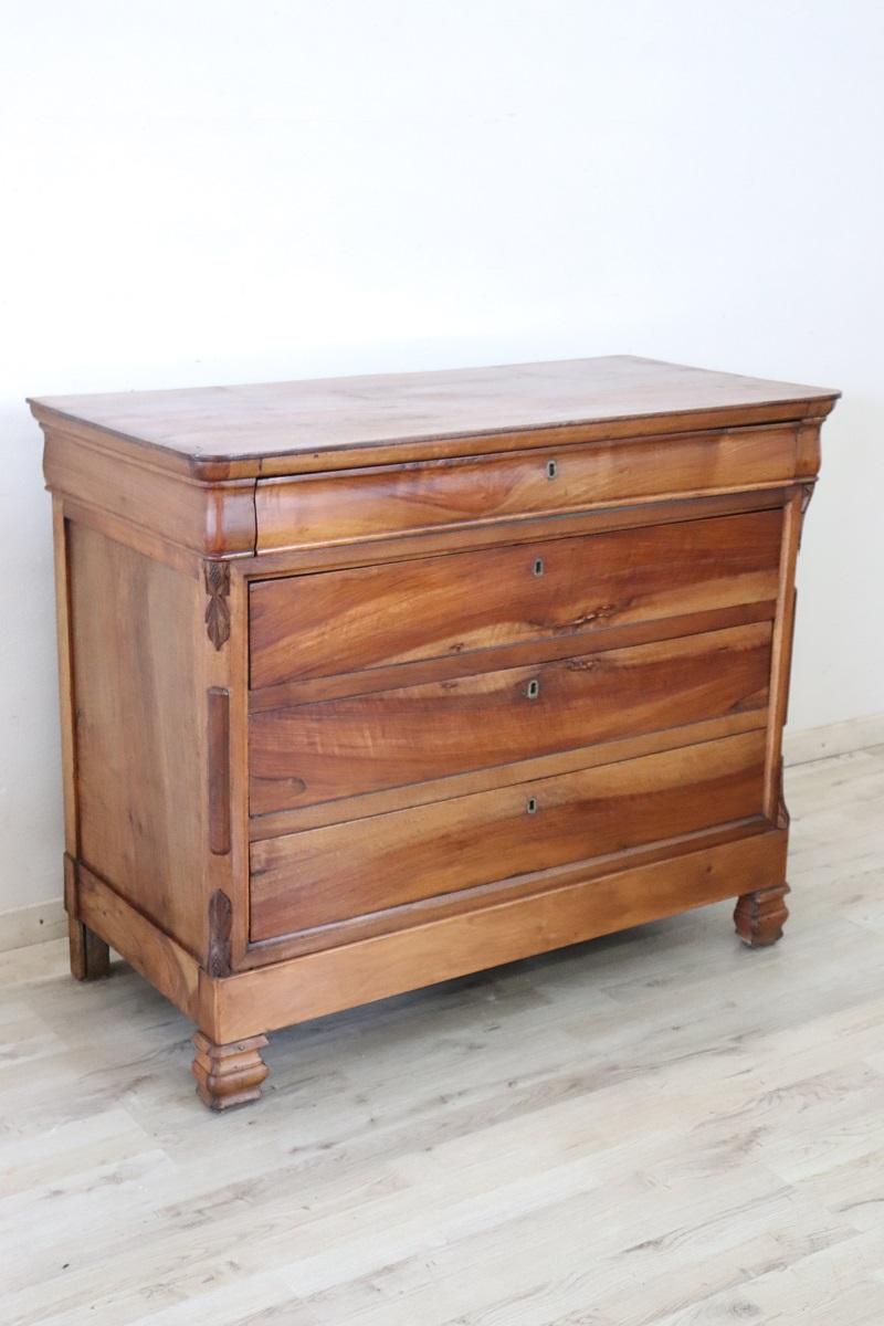 We are pleased to present this fine Italian antique chest of drawers dating back to the mid-19th century. Crafted from solid walnut, this chest of drawers boasts a sturdy construction that ensures its durability, while its light tone gives it a