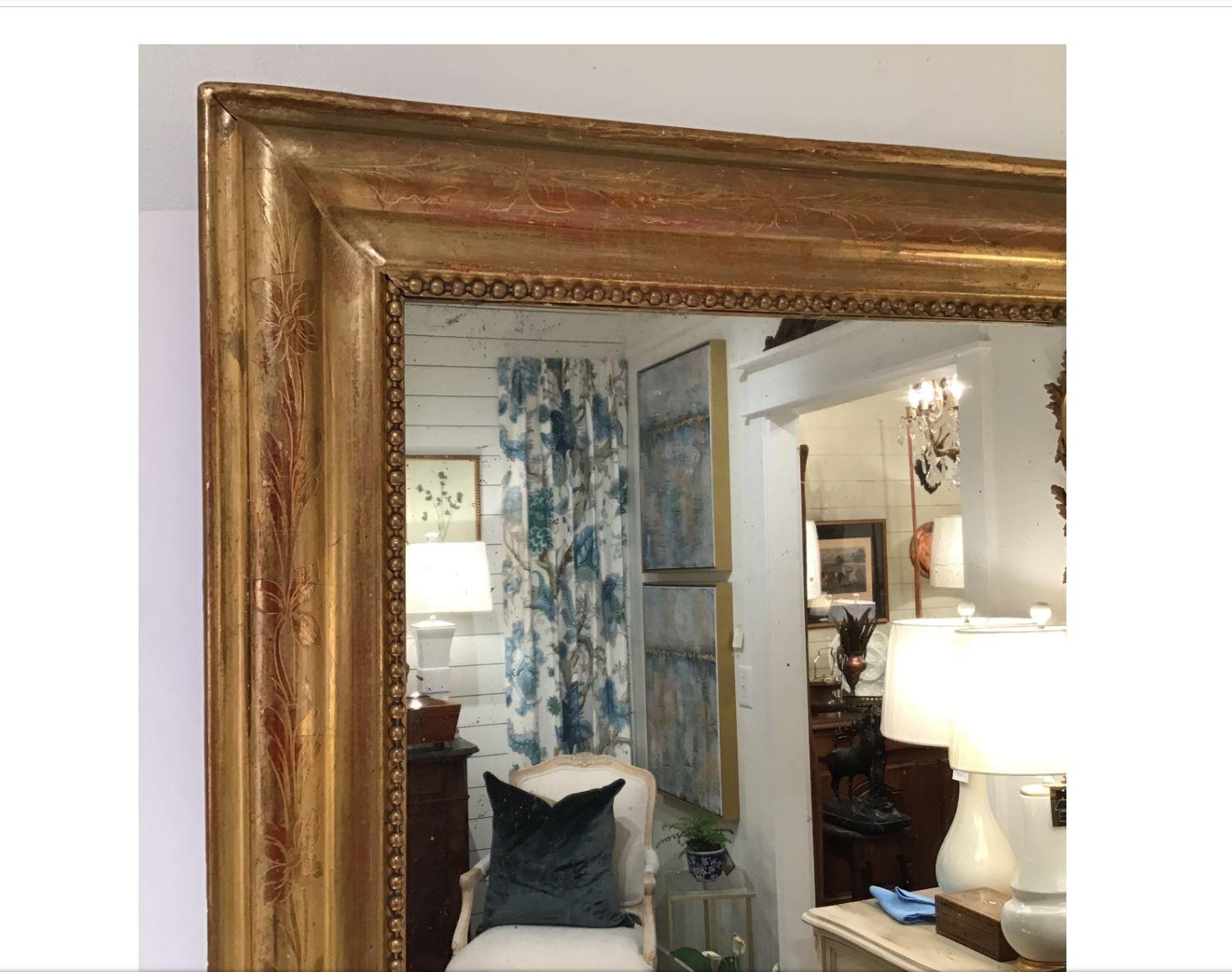 An absolutely beautiful square 19th century Louie Philippe mirror in excellent condition. The wonderfully designed gilding with no missing areas gracefully brings out the mirror and would be a marvelous addition to any room!
