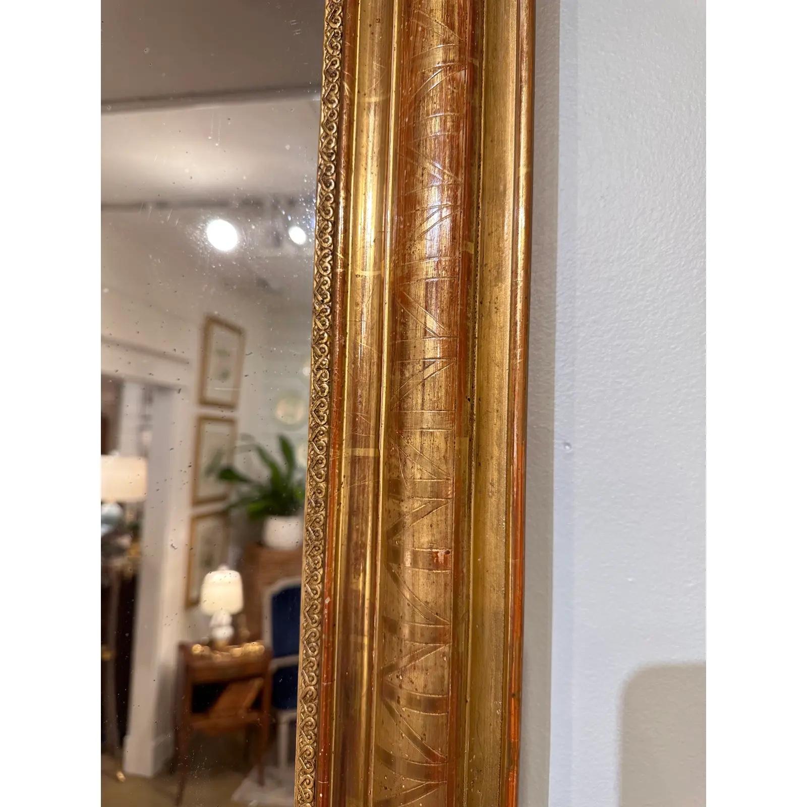 This is a beautiful Louis Philippe mirror! This mirror holds to a simple quiet design without a lot of busyness going on. However, there is delicate engraving on the edges that adds just a touch of ornamentation. This mirror is unique in that it I.