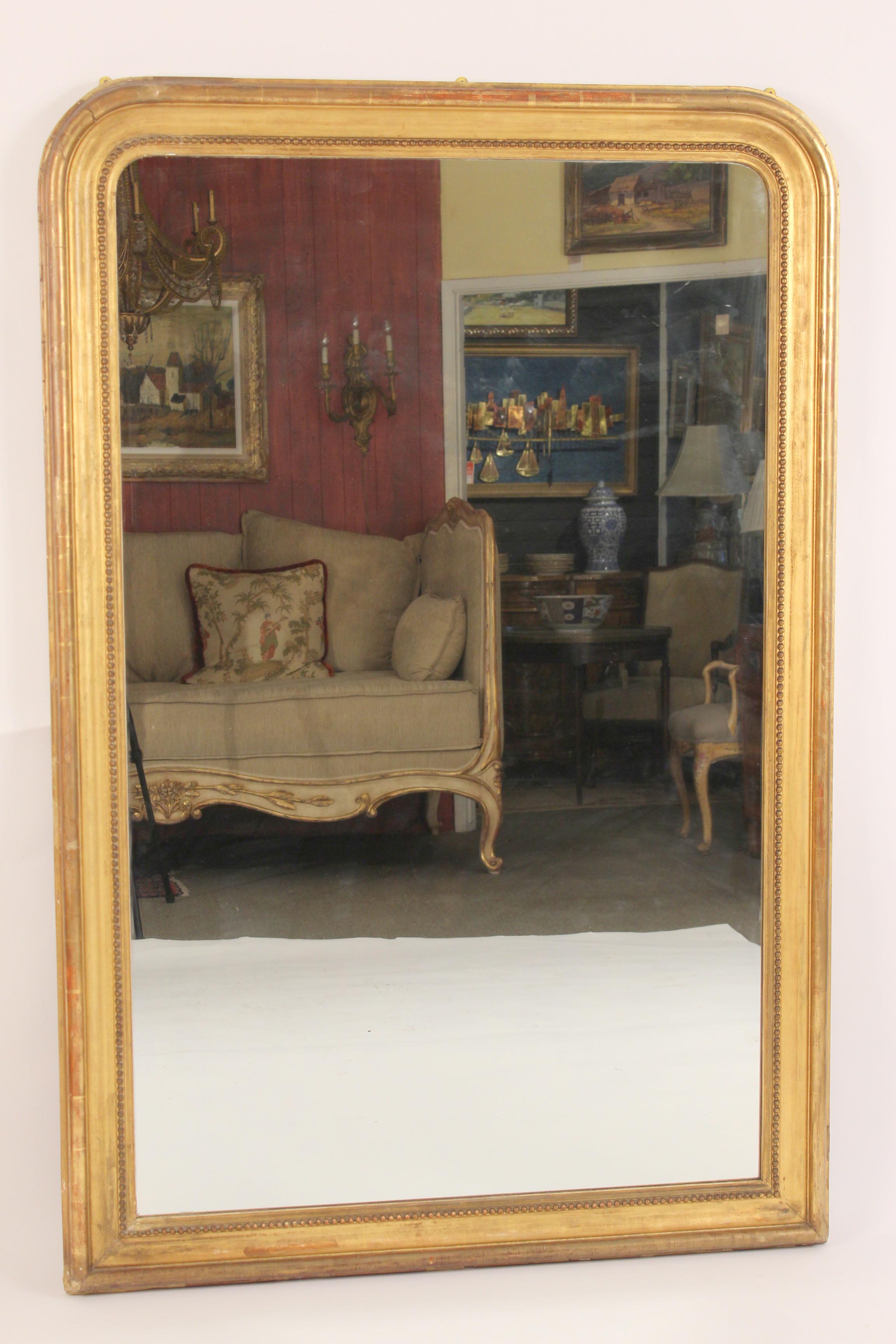 Antique Louis Philippe style giltwood mirror, late 19th century.