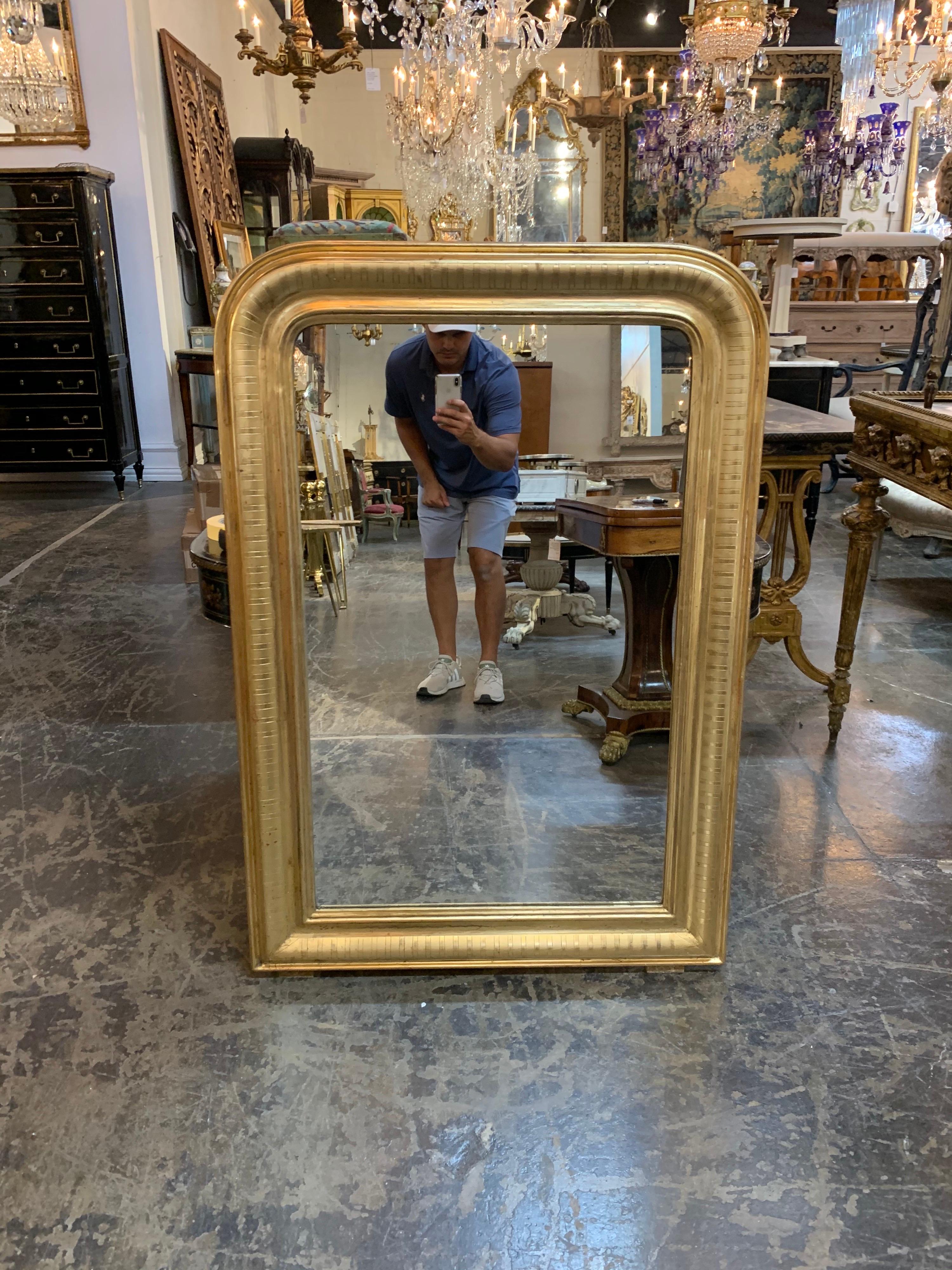 Gorgeous Louis Philippe mirror with gold gilt. Beautiful polished look and the mirror has an interesting bar pattern. So pretty!