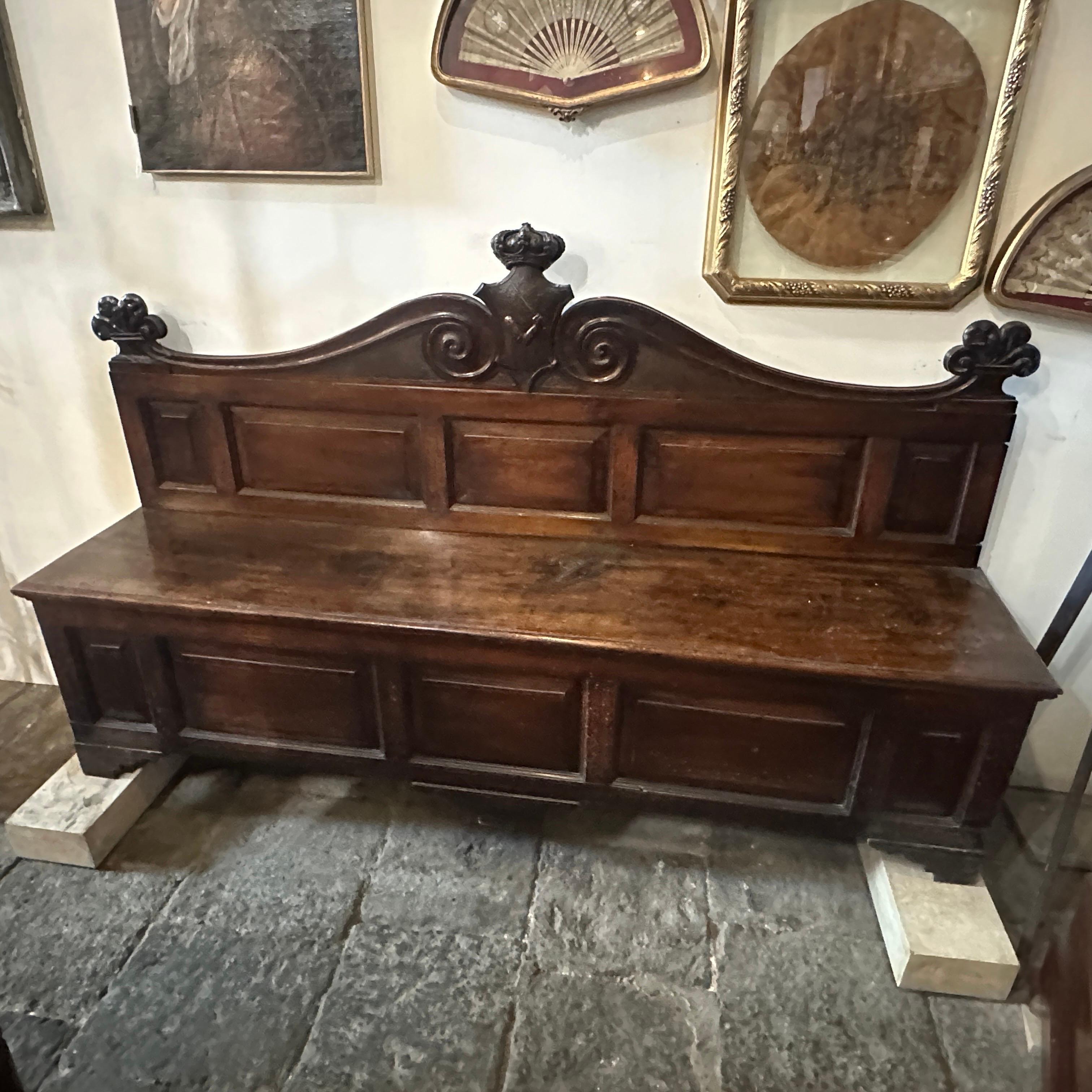 A unique walnut wood bench that belonged to the noble Sicilian Spatafora family. It' is a piece of furniture that reflects the design characteristics of the Louis Philippe style, which was prominent in the mid-19th century, particularly during the