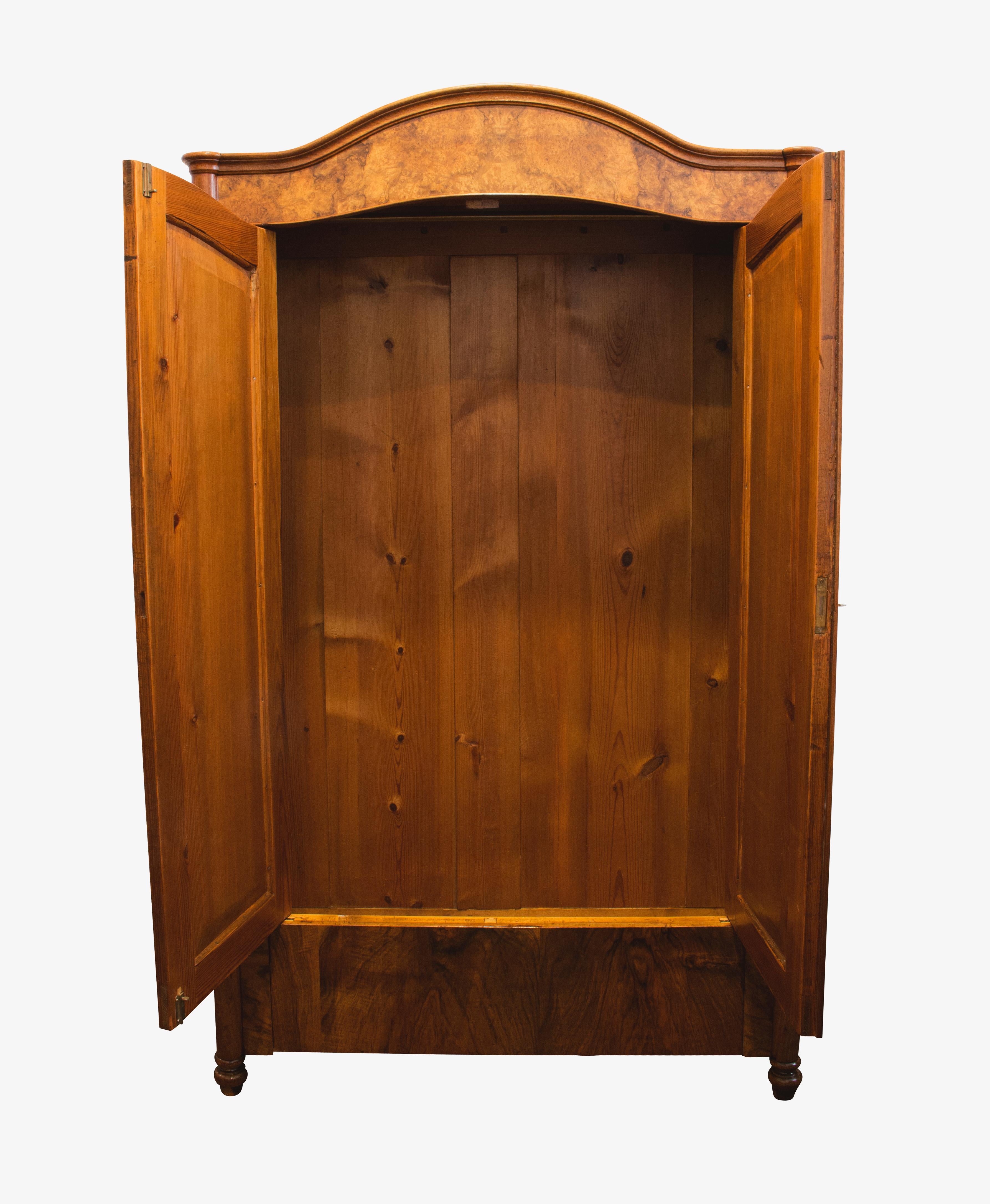 Wonderfully small walnut cabinet or wardrobe veneered on a pine body. The cabinet dates from the time of the late Biedermeier period (Louis Philippe). In a very well restored condition. An interior division in the form of shelves is included in the