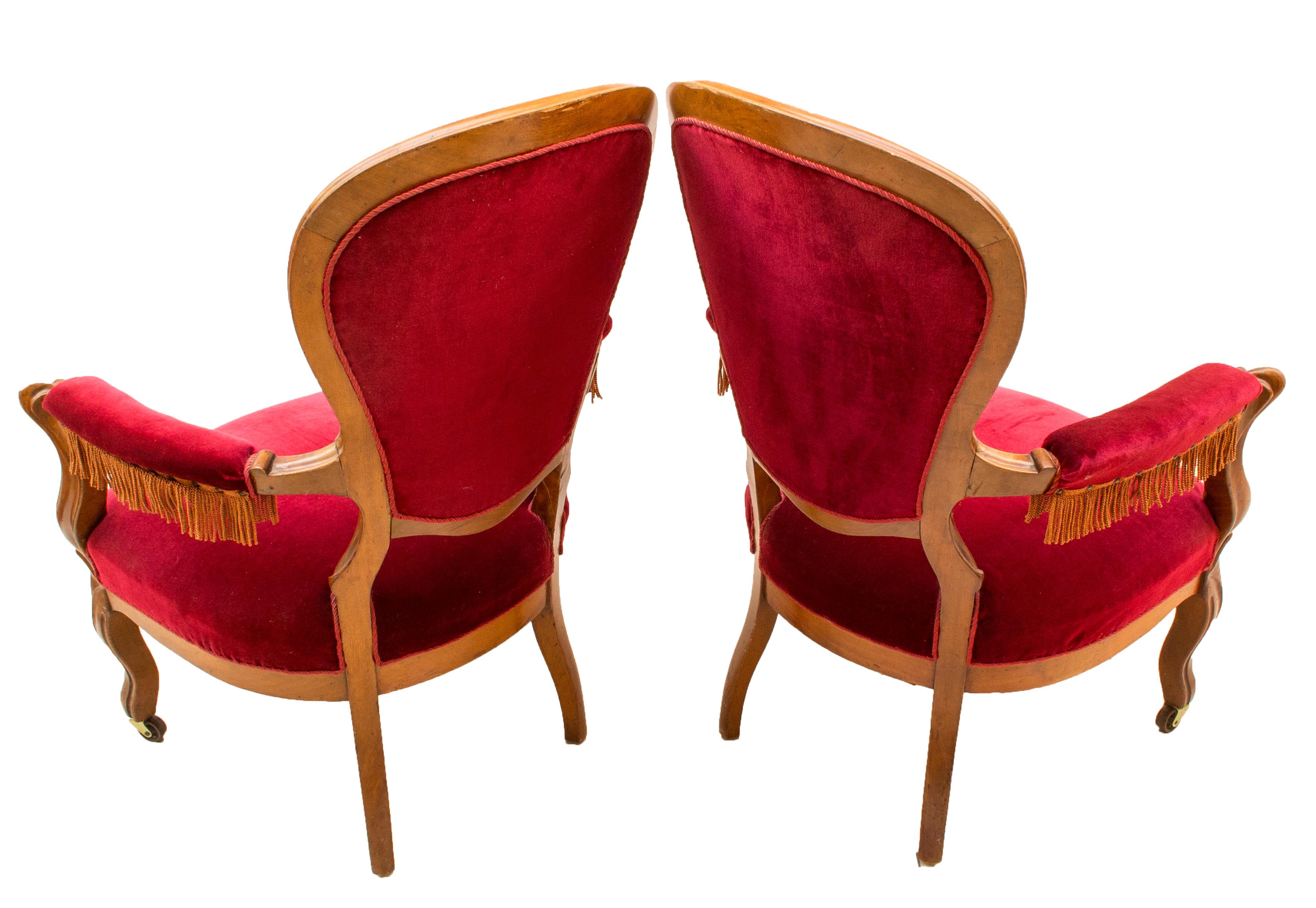 The two armchairs original upholstery. The chairs are made of solid mahogany wood and from the time of Louis Philippe, circa 1860. Chairs are firm, do not wiggle. The chairs weren't restored by us. 