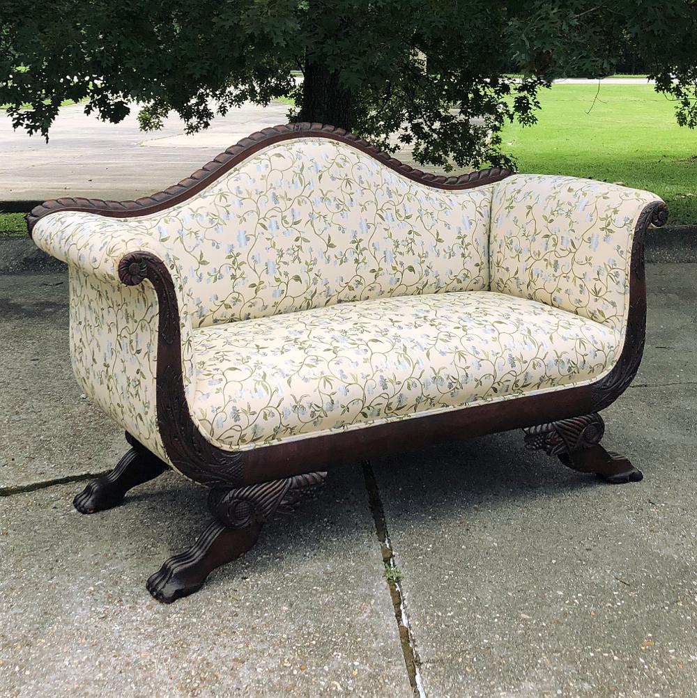 The tailored yet graceful lines of the Louis Philippe period have transcended time, as evidenced by this 19th century Louis Philippe sofa, handcrafted from exotic imported mahogany and sculpted to perfection by very talented artisans. Hand-carved