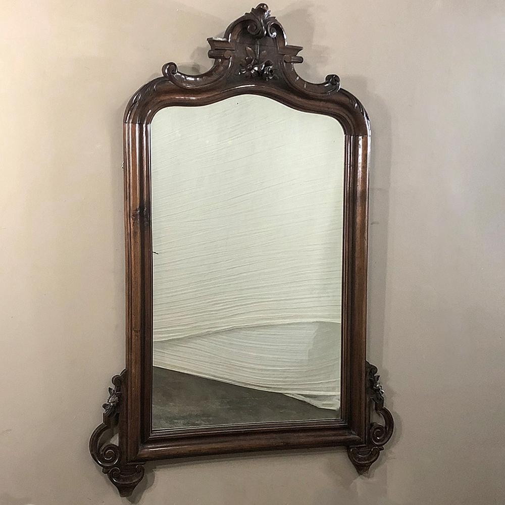 19th century Louis Philippe period rosewood mirror speaks for itself regarding its understated elegance, clean lines and form, executed with the most exotic of imported woods from the Americas highly prized by the finest furniture makers in Europe