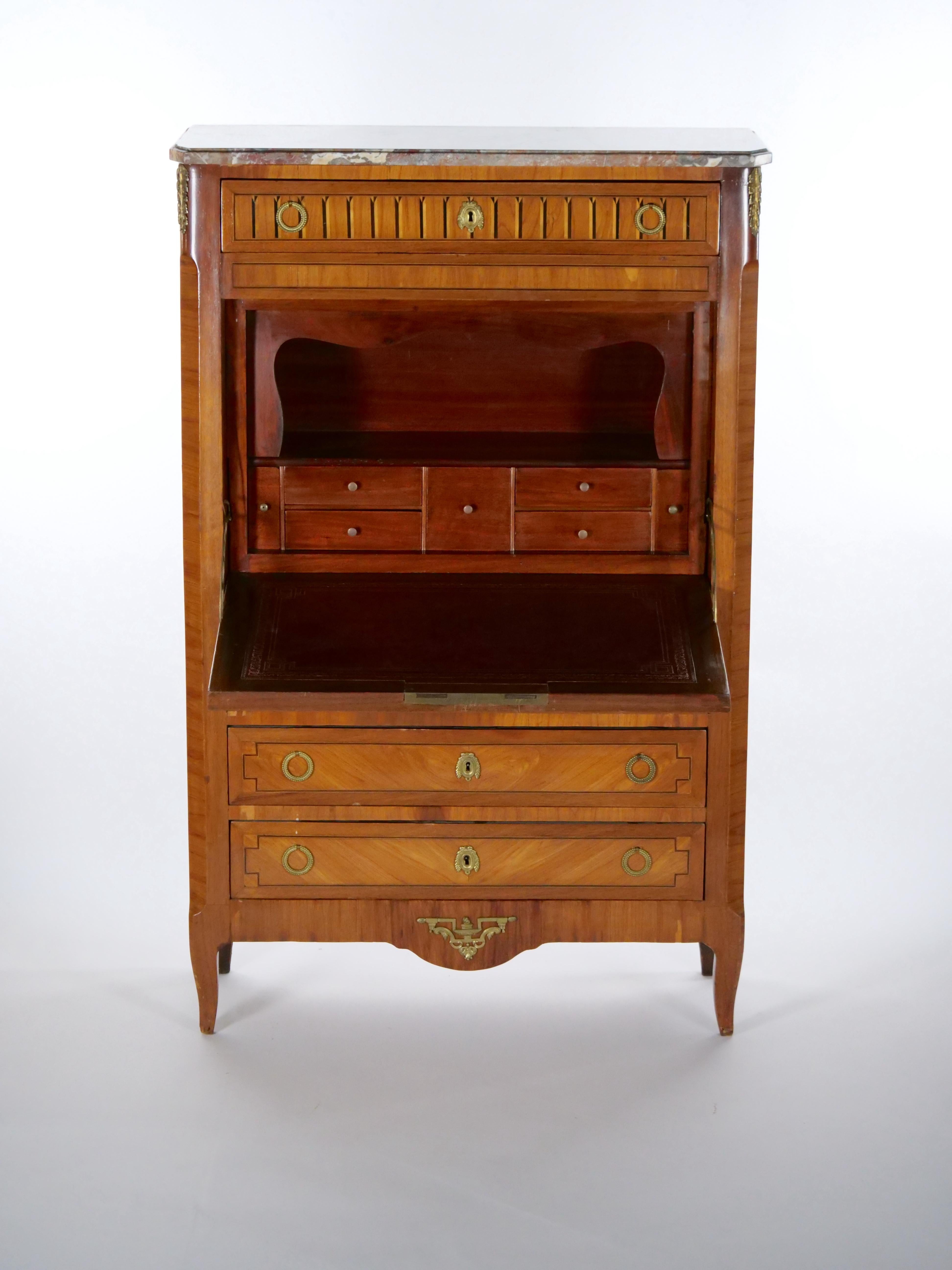 Beautiful craftsmanship Louis Philippe style secretary chest cabinet desk in a satin / burl wood with exterior front inlay musical instruments and flowers marquetry scene details. The secretary features lot of storage drawers above fall-front,