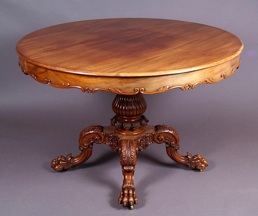 19th century Louis Philippe style round table
A Louis Philippe style table with a large round top, under which there is a strip, carved from the bottom in the form of leaves. The table top rests on a turned, narrowed, carved shaft, which is
