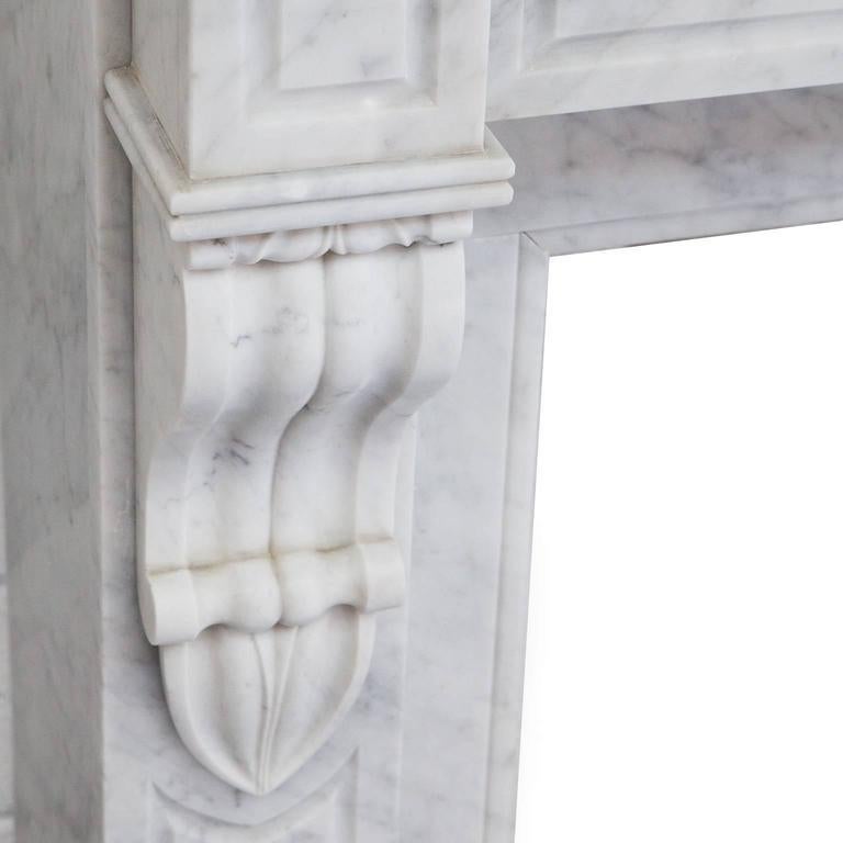 Unique opportunity to acquire a rare 19th century antique, French Louis Phillipe fireplace mantel. Hand carved in desirable Italian Carrara marble. Recessed paneled jambs and frieze with carved centre circle and elegantly carved corbels.

Full
