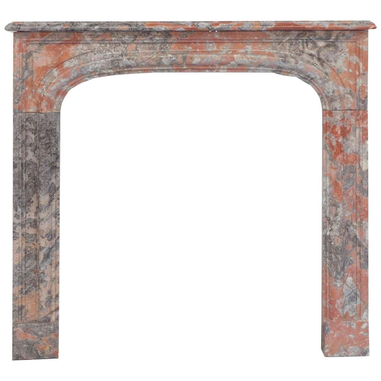Are 19th century antique French Louis Phillipe marble fireplace mantel. Hand carved in unusual rouge grey Italian marble. Simple with recessed jambs and frieze with elegantly moulded shelf detail. Full measurements: Shelf width 44