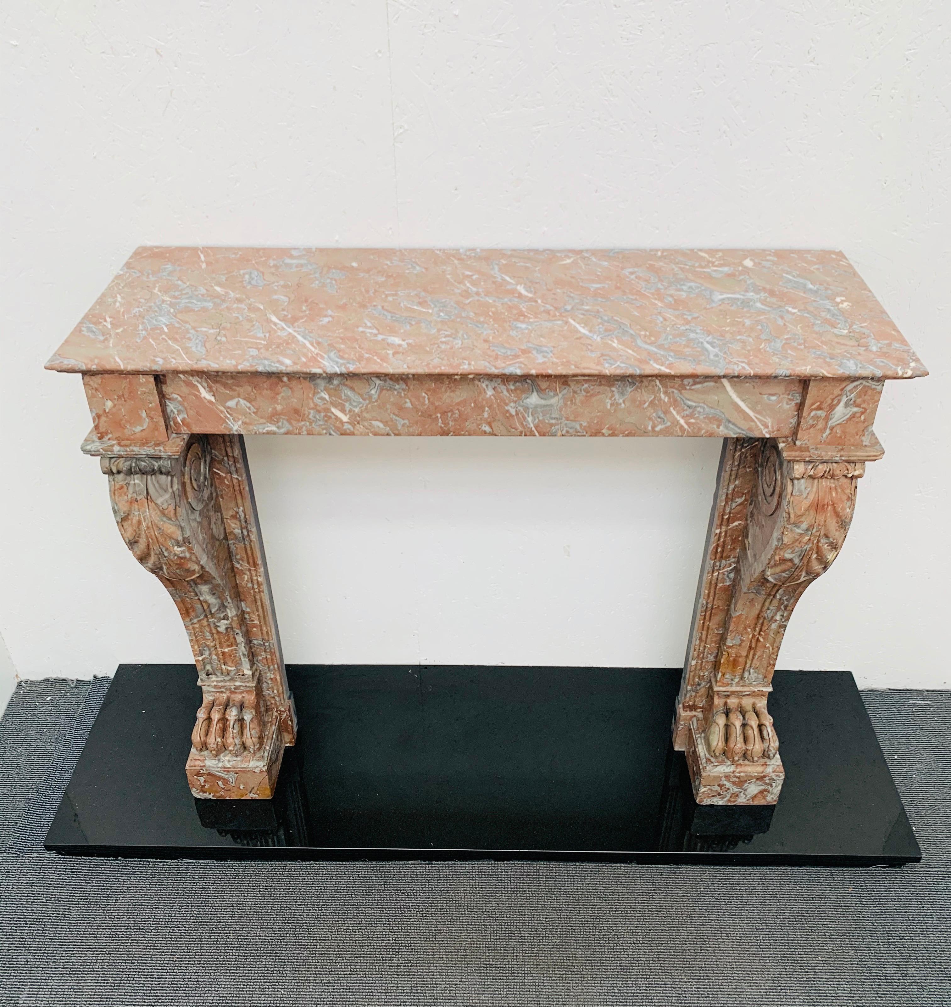 19th century French Louis Philippe I Rouge marble fireplace mantel (fireplace)-piece.
With hand carved scrolled leaves on fluted jambs and claw carvings on base of each foot block. In good condition, recently salvaged from a London period town