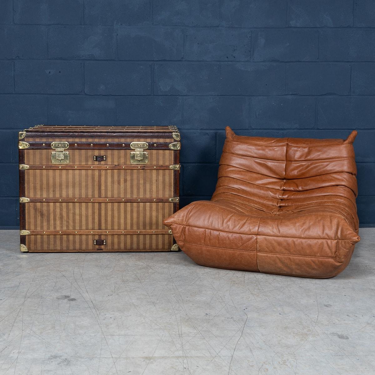 Antique 19th Century Louis Vuitton trunk in striped canvas. The earliest Louis Vuitton trunks were revolutionary when they hit the market. It had a flat lid, rather than the domed lid that was then conventional, which meant it could be easily