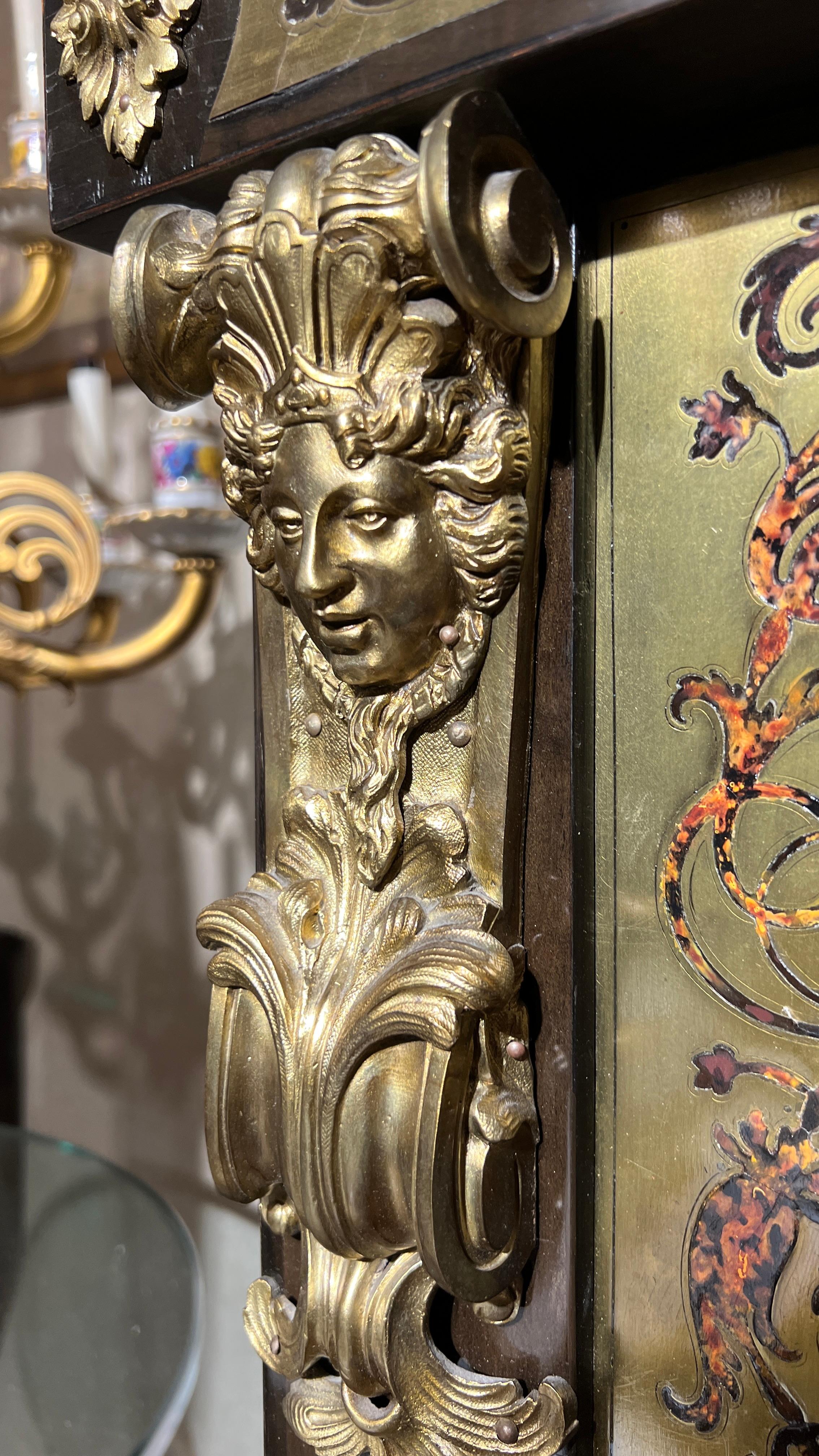 Exceptional antique (late 19th century) ebonized side cabinet in the French Louis XIV style with brass marquetry in the manner of André-Charles Boulle.  With black granite top and finely cast gilt bronze mounts.  34 3/4 by 15 1/4 by 52 inches.