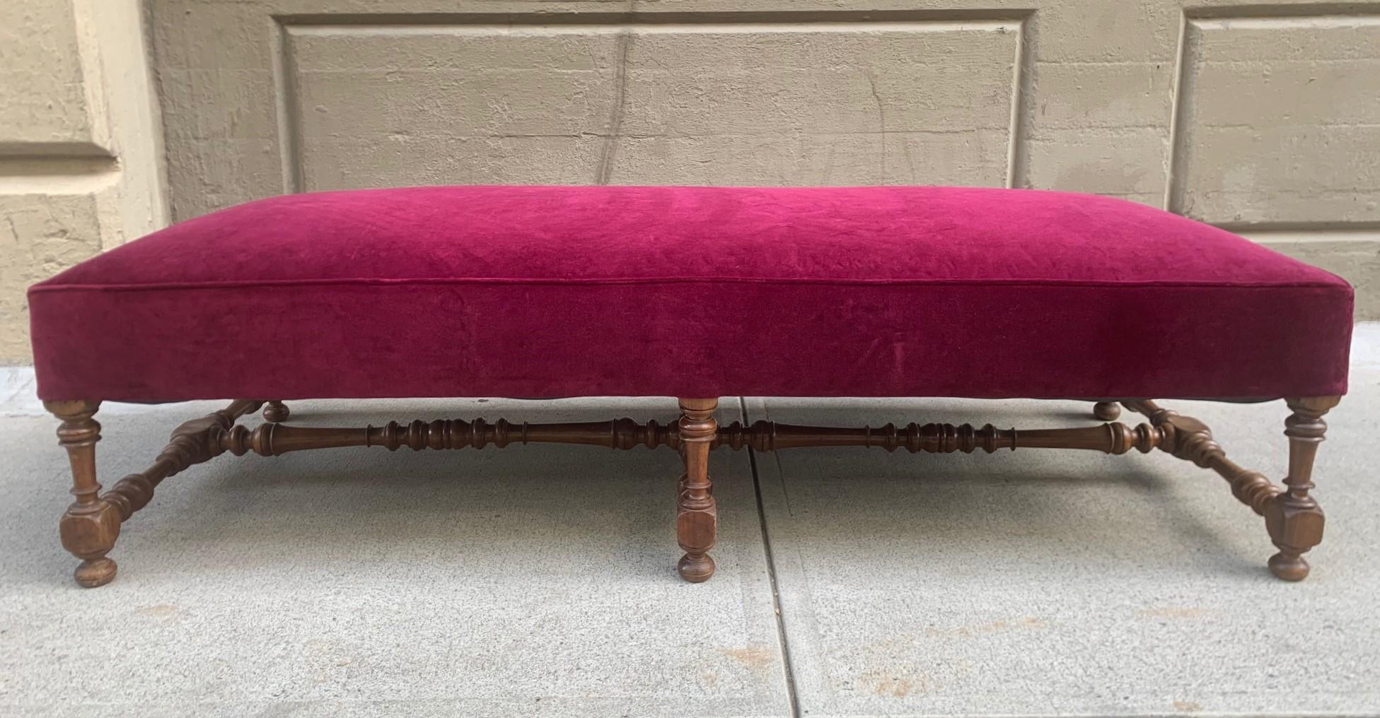 19th Century, Louis XIV style walnut carved bench with velvet upholstery. The bench has a solid walnut carved frame.
