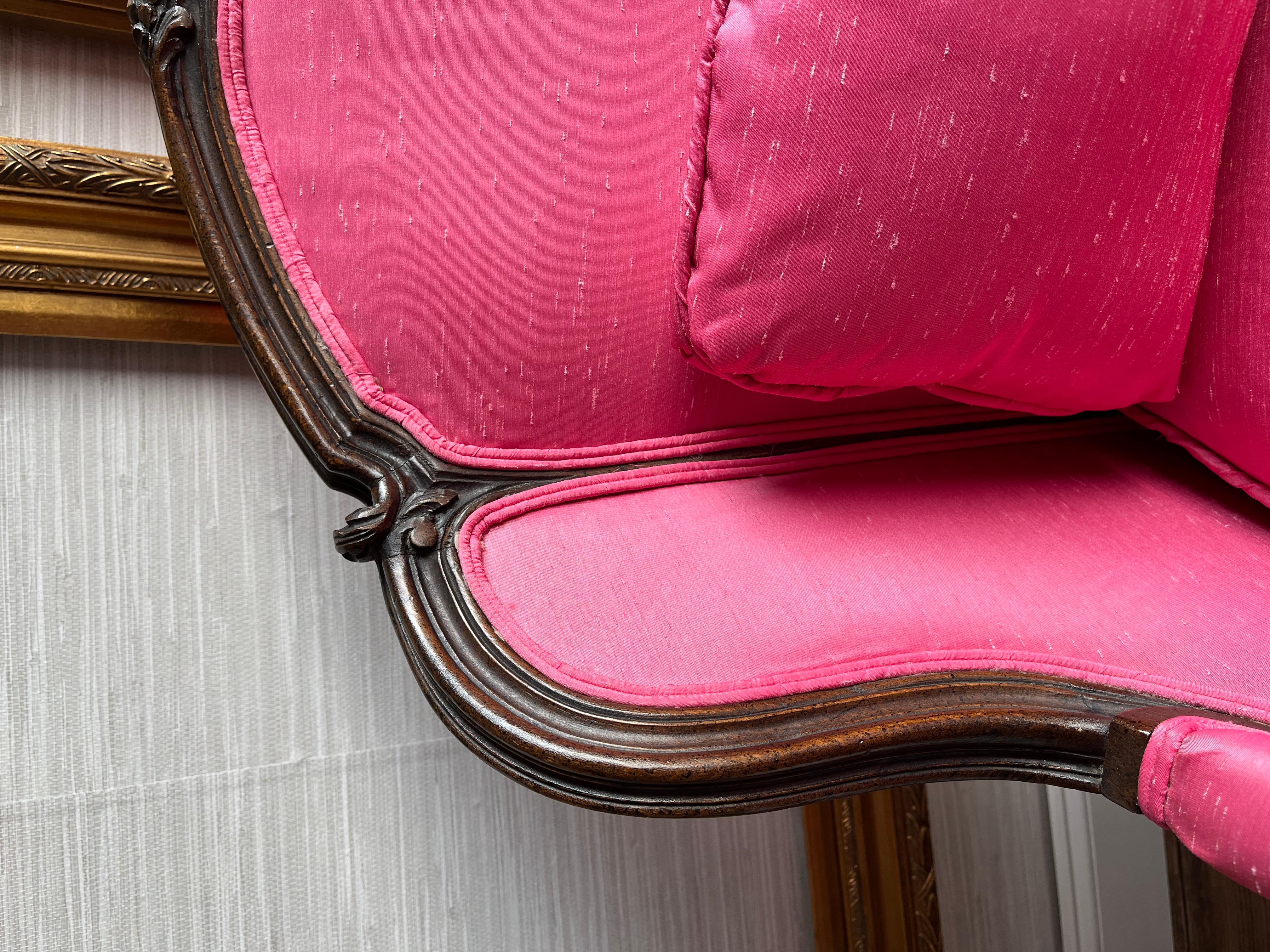 Step into a world of enchantment with these absolutely breathtaking Louis XV bergere armchairs, true masterpieces of elegance and charm. With beautiful wooden frames adorned with ornate details and gracefully curved cabriole legs, these chairs exude