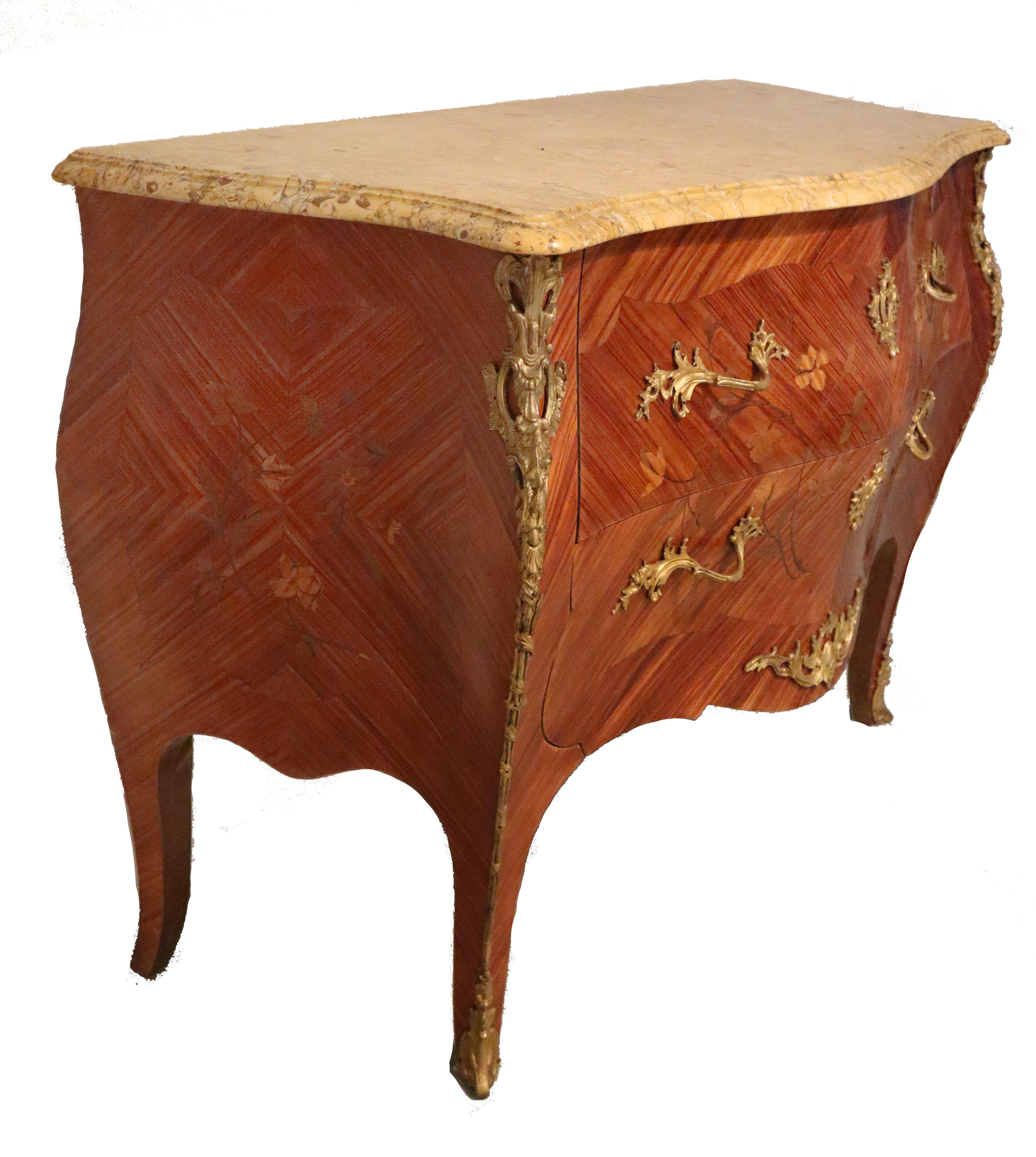 19th century French Louis XV bombe marble-top commode features exotic imported woods crafted in an exceedingly complex bombe shape, then adorned with lavish marquetry inlay, exquisite cast bronze ormolu mounts, and of course, a luxuriously veined
