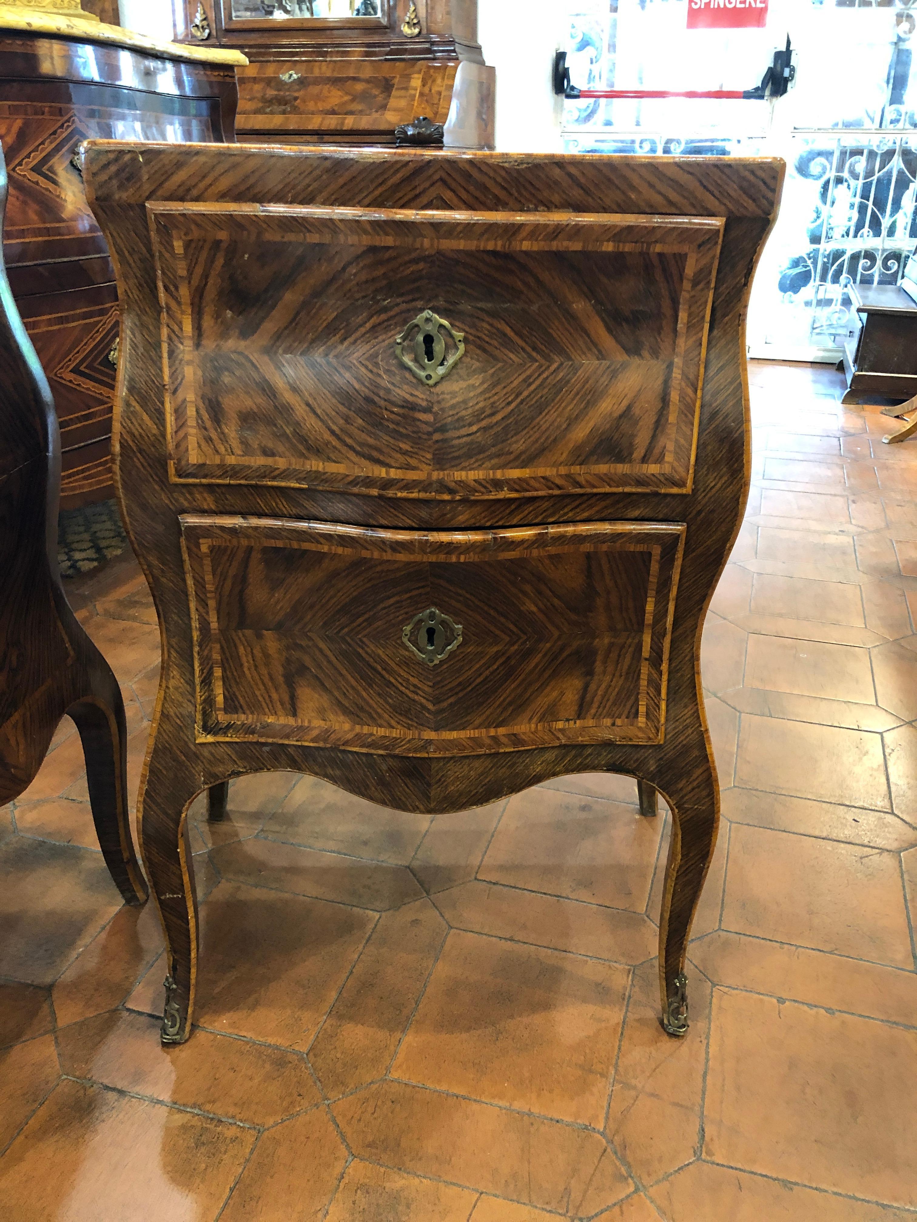 Pair of Italian bedside tables, Sicilian provenance, moved on the sides and on the front, late 19th century, Louis XV style. In good condition, some cracks on the sides, light and not deep, not to compromise their stability.