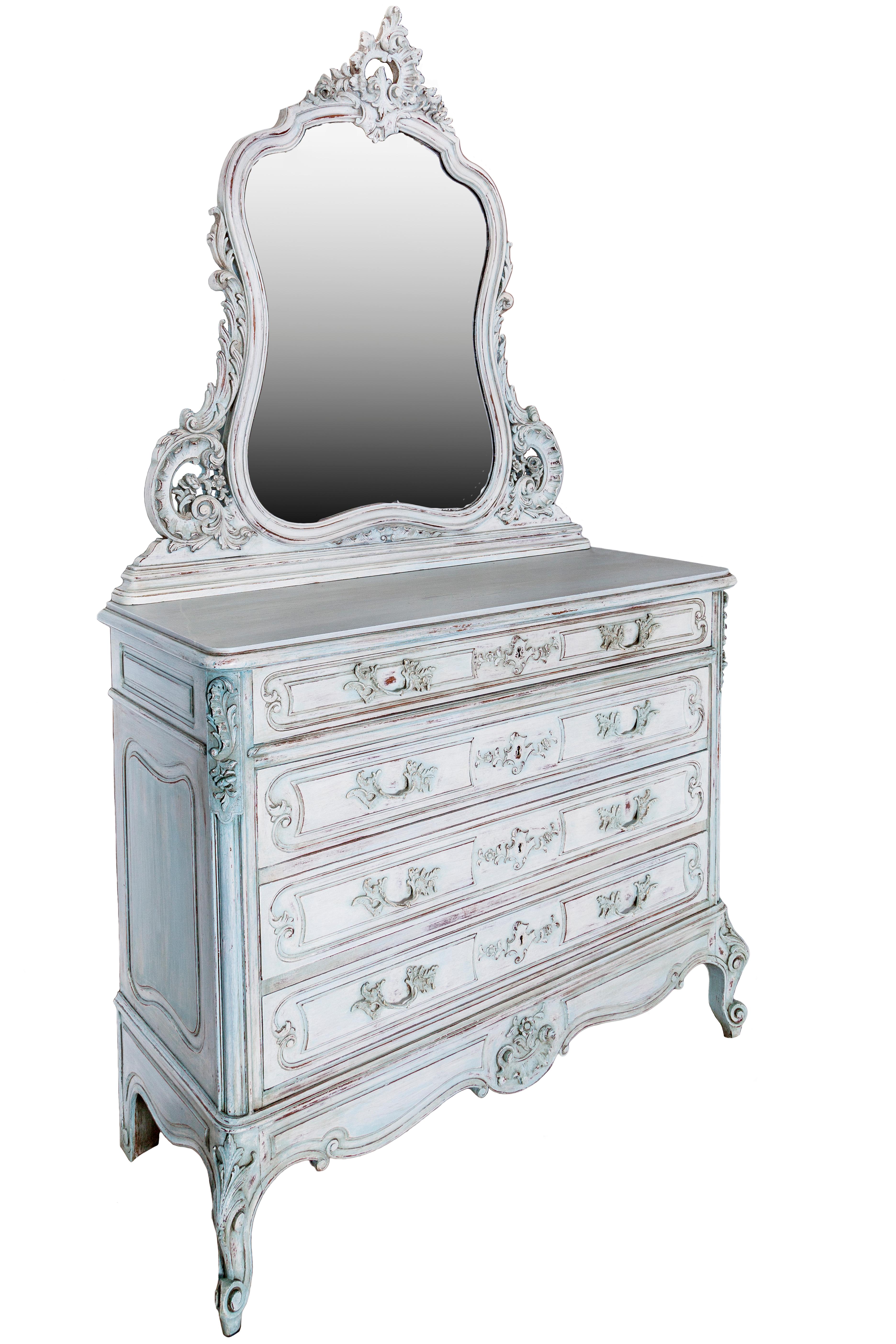 19th century painted commode in Louis XV style.
It has a marble top surmounted by a bevelled mirror framed with notched drawings in rocaille style.
On the front, there are four drawers.
Restored and finished with beeswax.