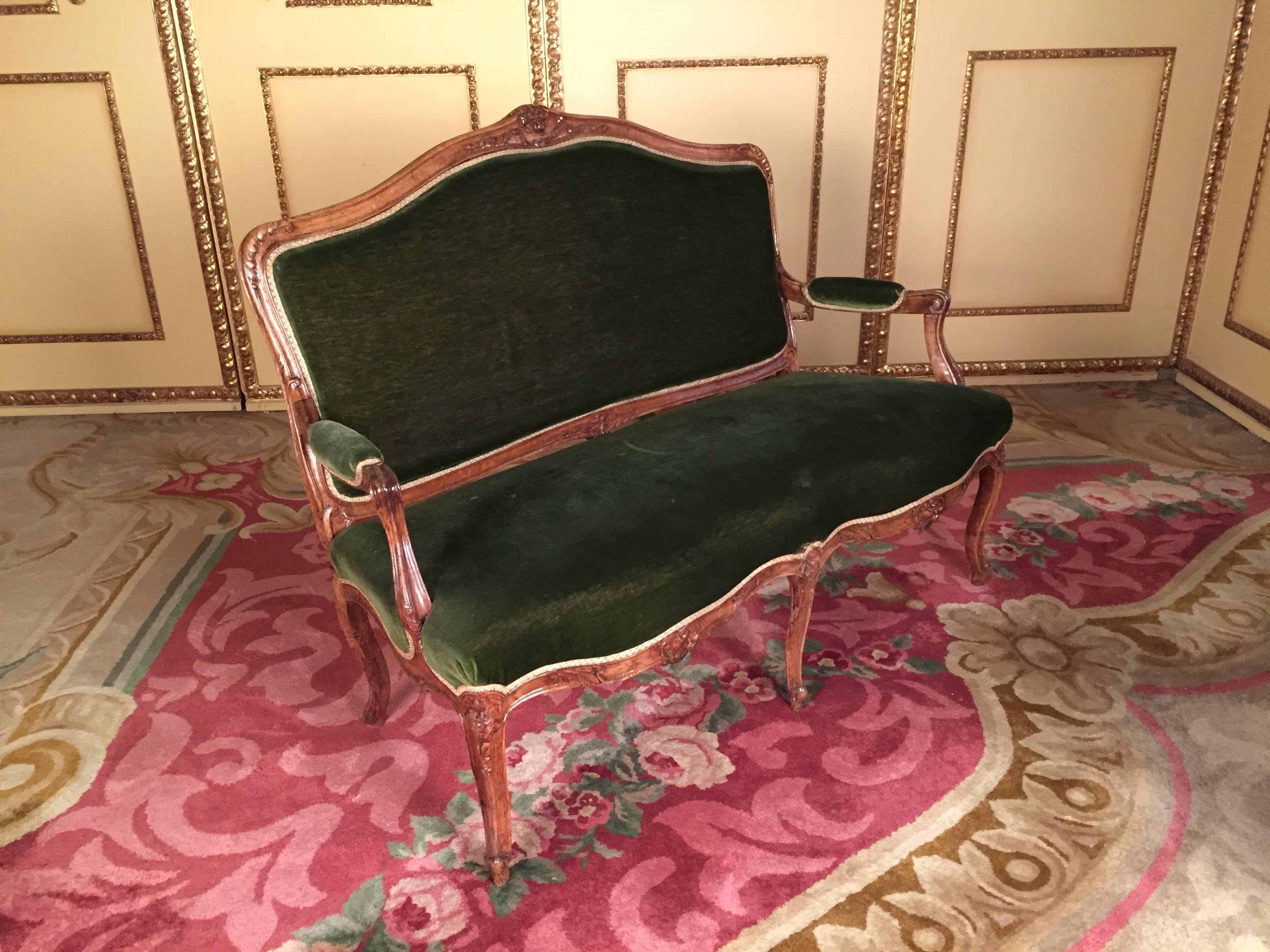 Solid walnut, hand-carved frame. Green velvet, historical upholstery in good condition.


(B-139).