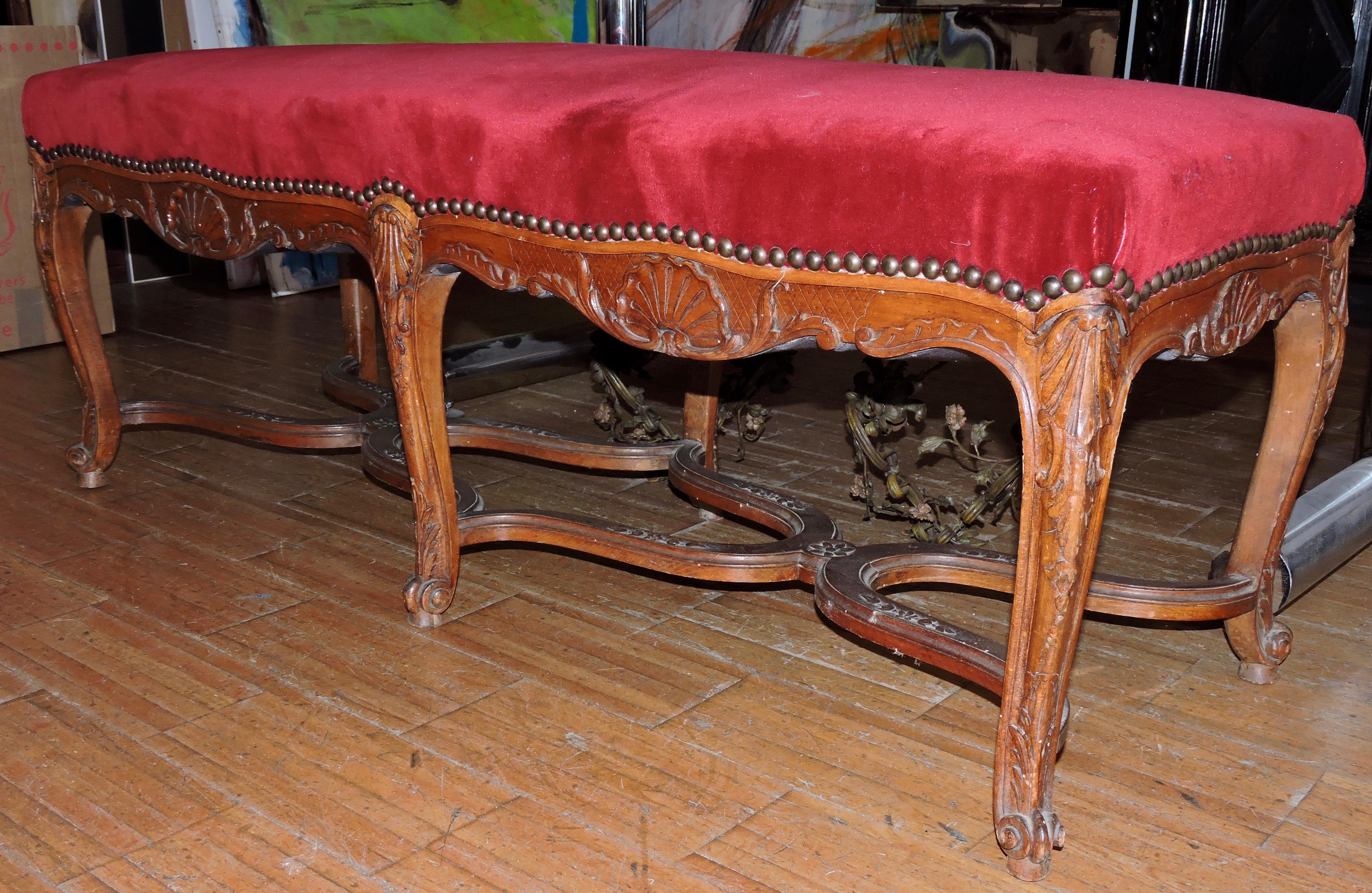 A 19th century Louis XV style carved wood large stool banquette.
 