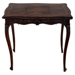 Antique 19th Century Louis XV Style Dark Wood Table with Floral Ornamental Carvings
