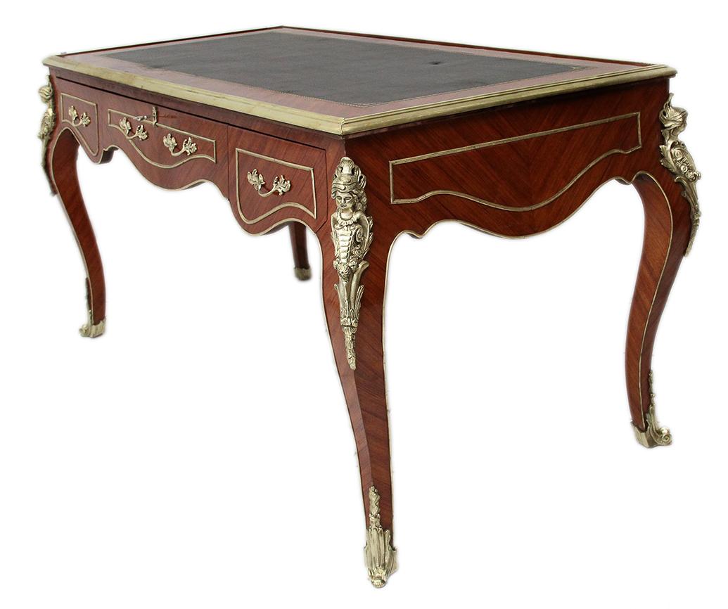 19th century Louis XV style desk with bronze mold and figures :
Elegant desk with brown leather top, underlined by a mold and decorated with bronze figures called 