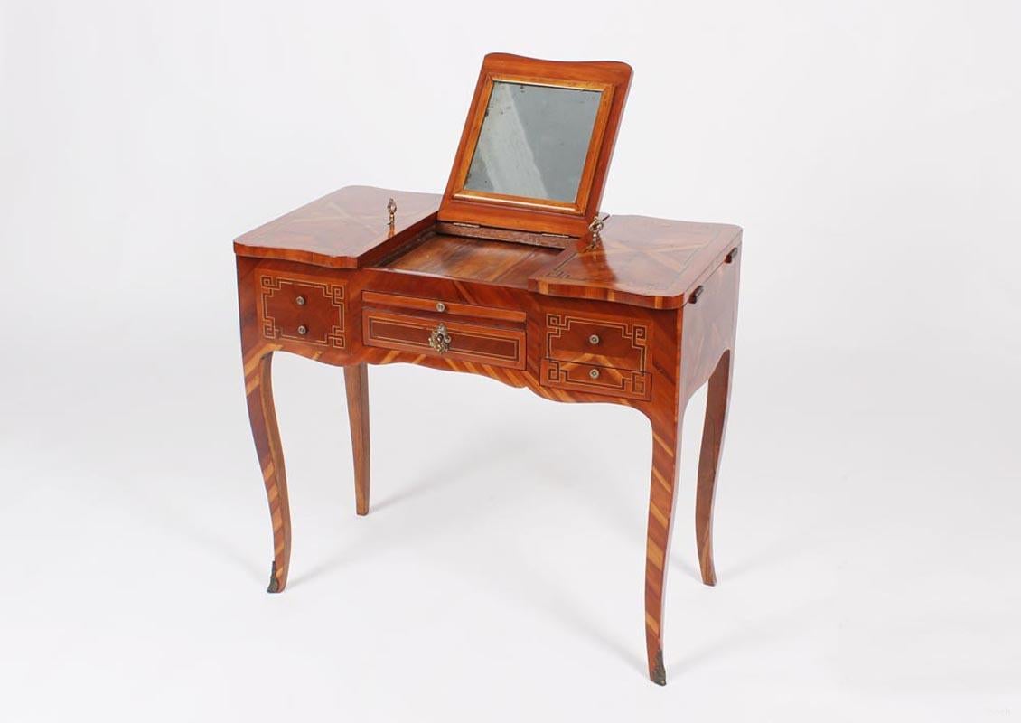 Historicist Poudreuse

France
Plum wood and others
19th century, Louis XV style circa 1890

Dimensions: approx. H x W x D: 75 cm x 80 cm x 45 cm

Description:
Small dressing table standing on curved square legs.
All sides intertwined band