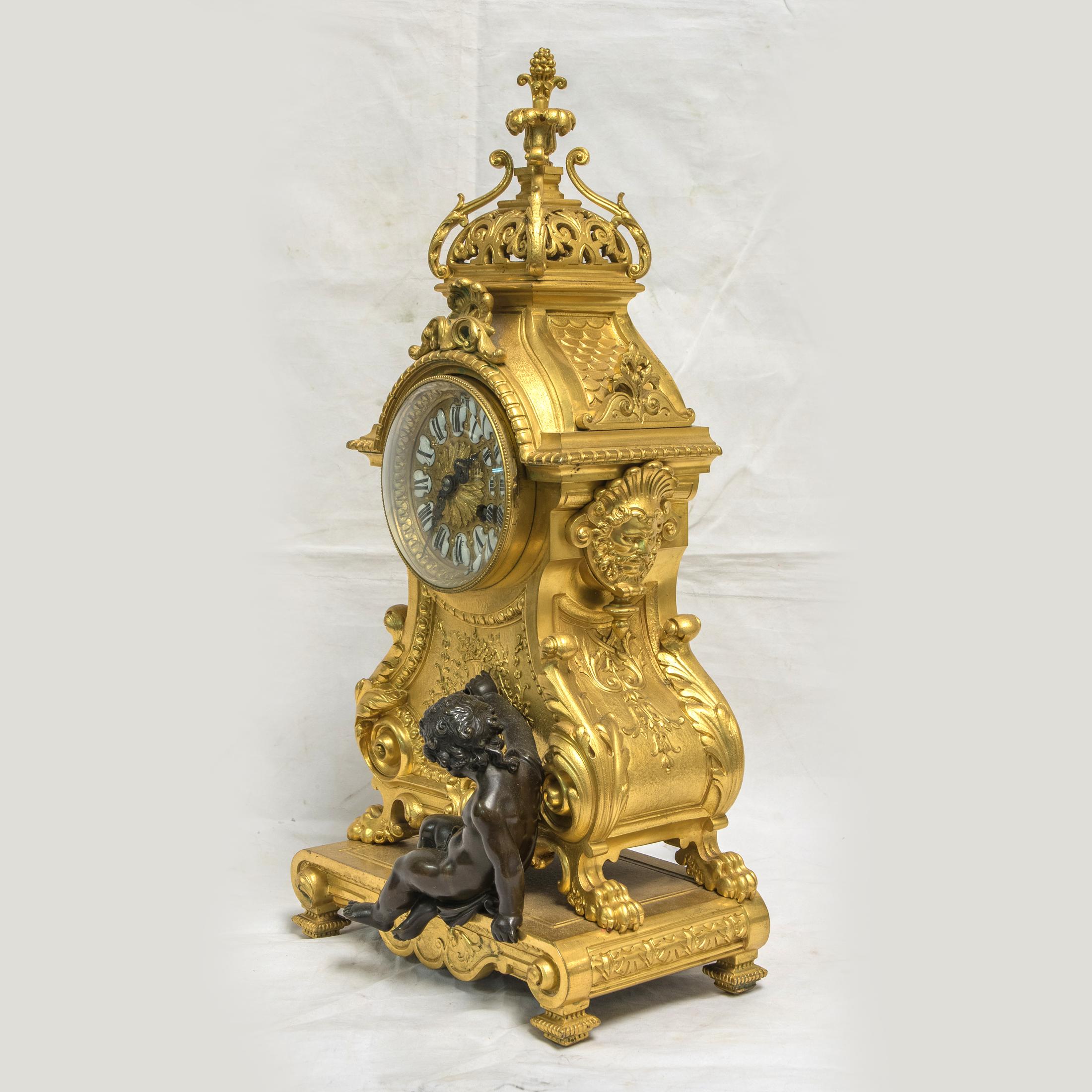 A fine quality Louis XV-style gilt bronze figural mantel clock by E. Godeau Paris.
This flamboyant mantel clock with a finely detailed seated patinated bronze putto. 

Movement: E. GODEAU PARIS
Origin: French
Date: 19th century
Dimension: 19