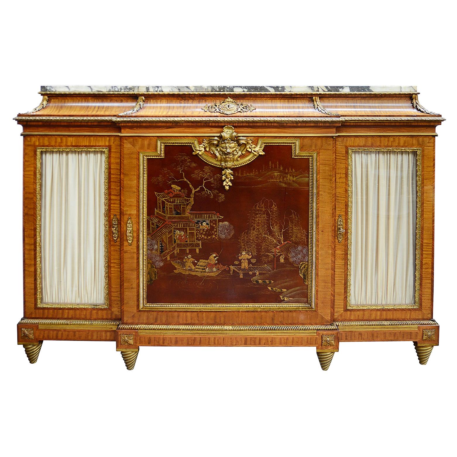 A fine quality late 19th century French Louis XV style break fronted side cabinet. Having its original Brèche Violette marble top, glazed doors on either side, opening to reveal shelves within. The central door having this wonderful japanned lacquer