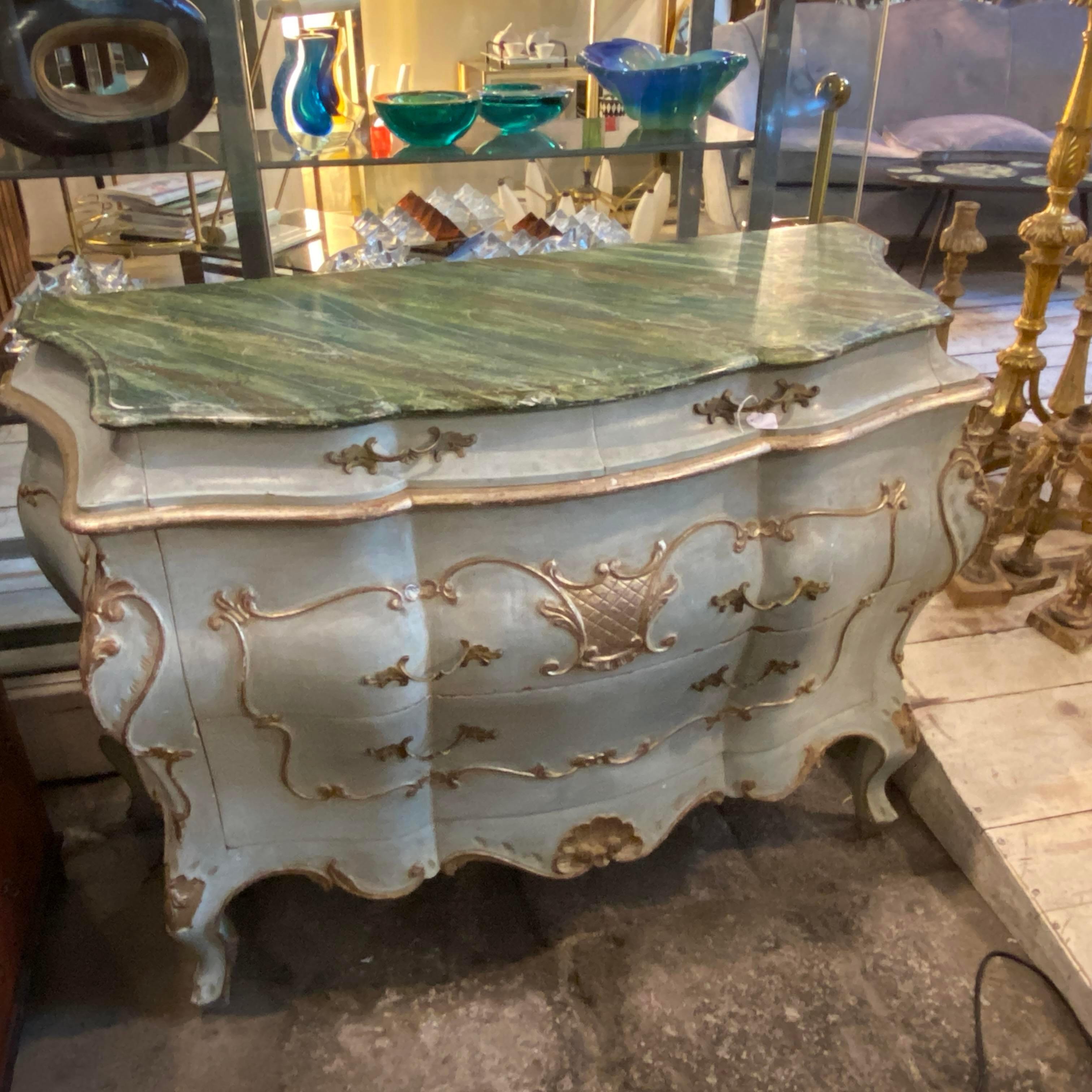 An amazing blue light and silver lacquered Venetian chest of drawers, lacquered green fake marble on the top, it's in original conditions with normal signs of use and age visible on the photo.