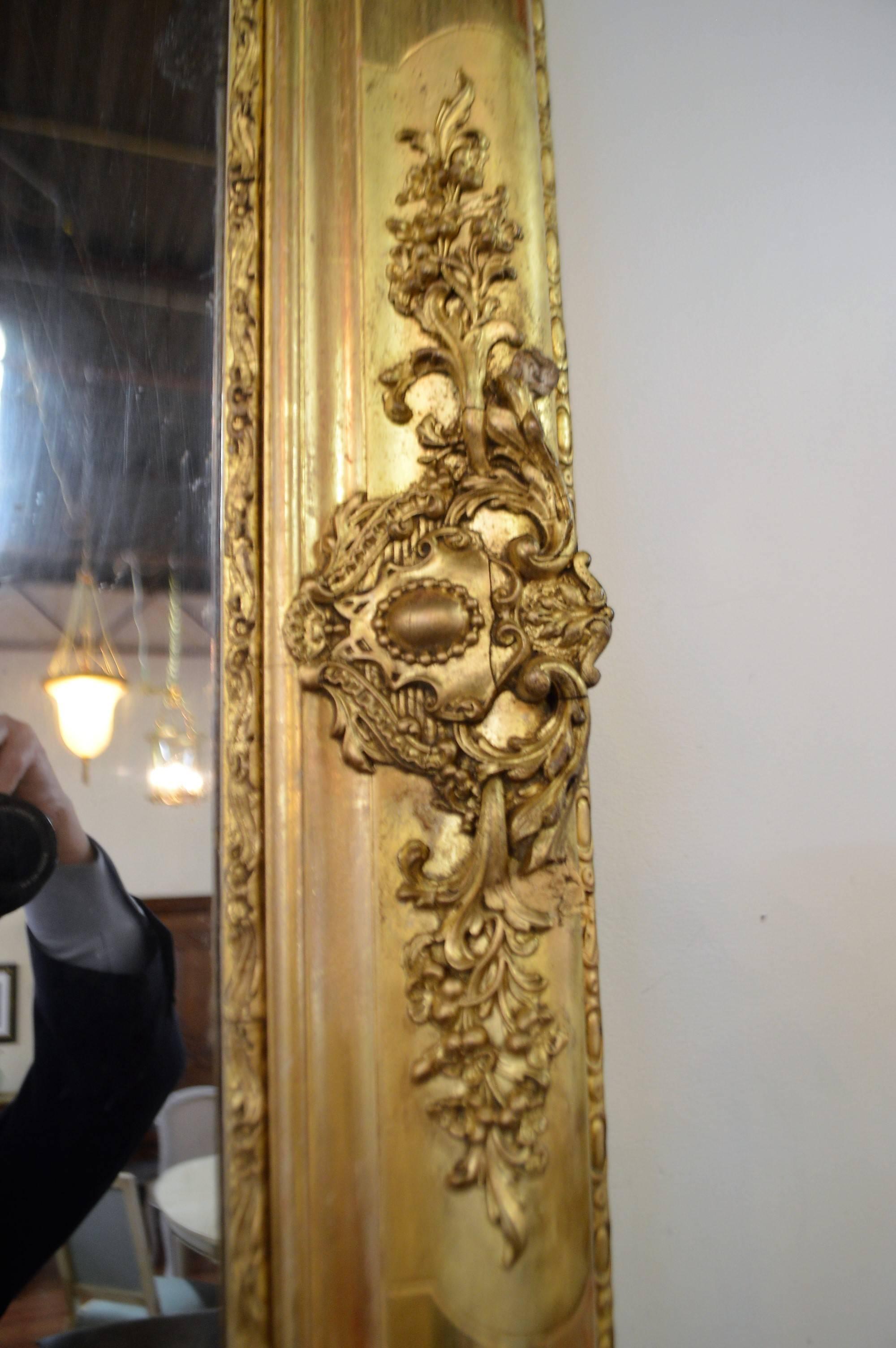 Gilt 19th Century Louis XV Style Large Gilded Mirror with Carved Details