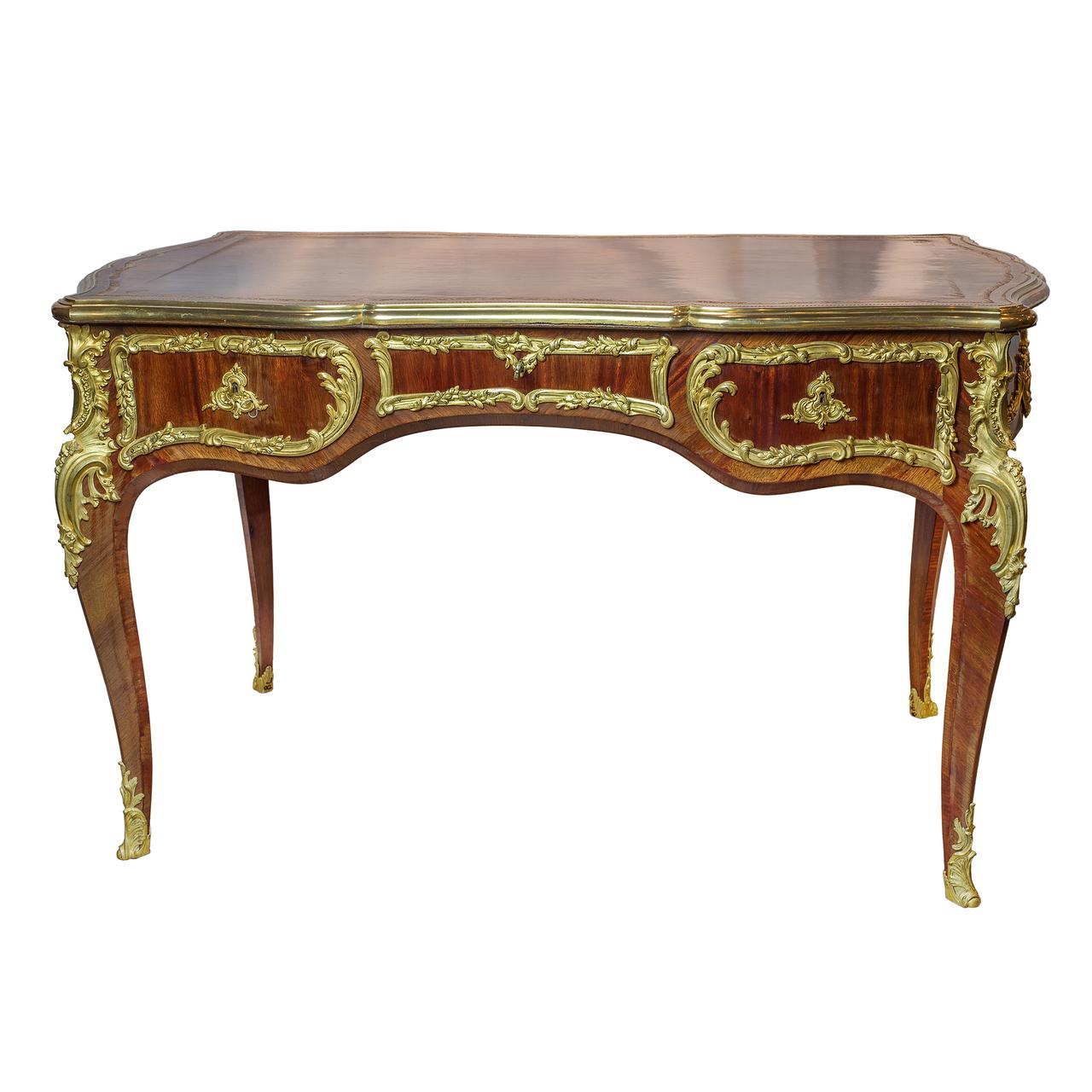 An exquisite quality French Louis XV style gilt bronze mounted tulipwood and kingwood bureau plat attributed to Joseph-Emmanuel Zwiener

Attributed to Joseph-Emmanuel Zwiener (1848-1895)
Date: 19th century
Origin: French
Dimension: H 29 3/4 in.