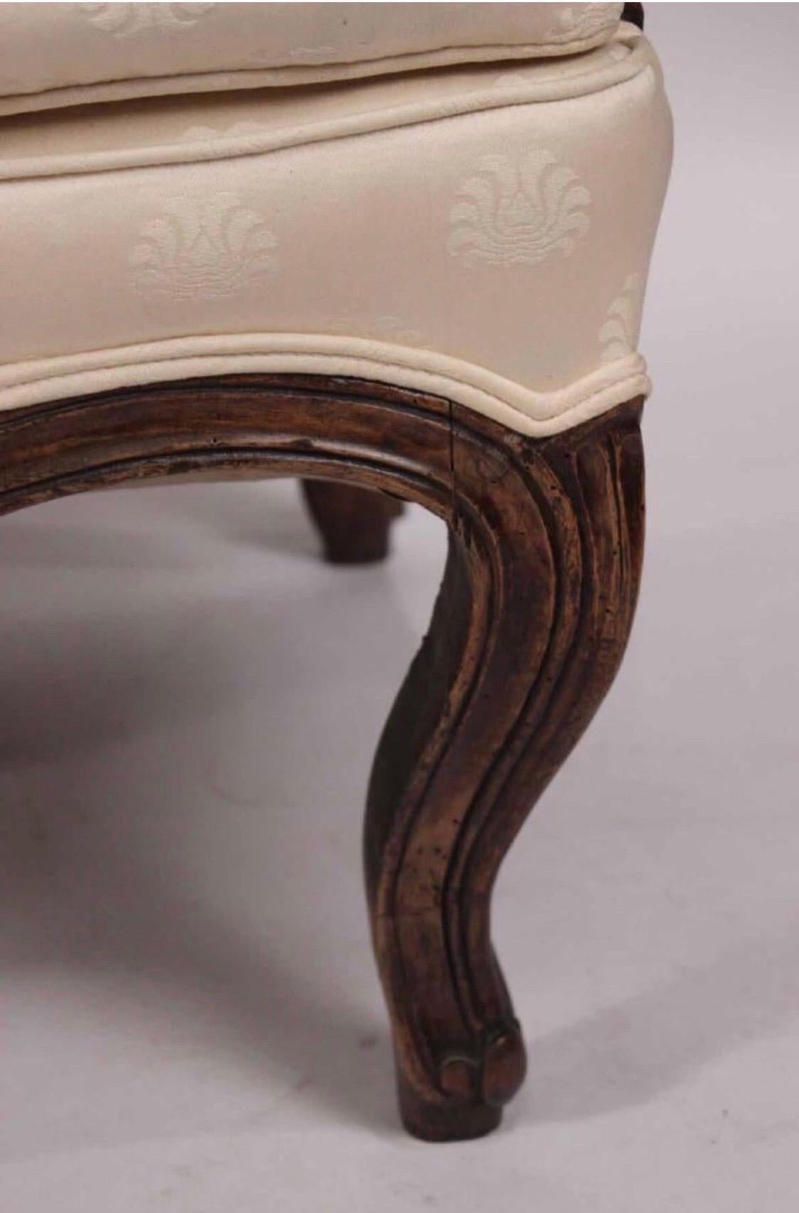 Late 19th century Louis XV style walnut serpentine sofa with carved flowers.