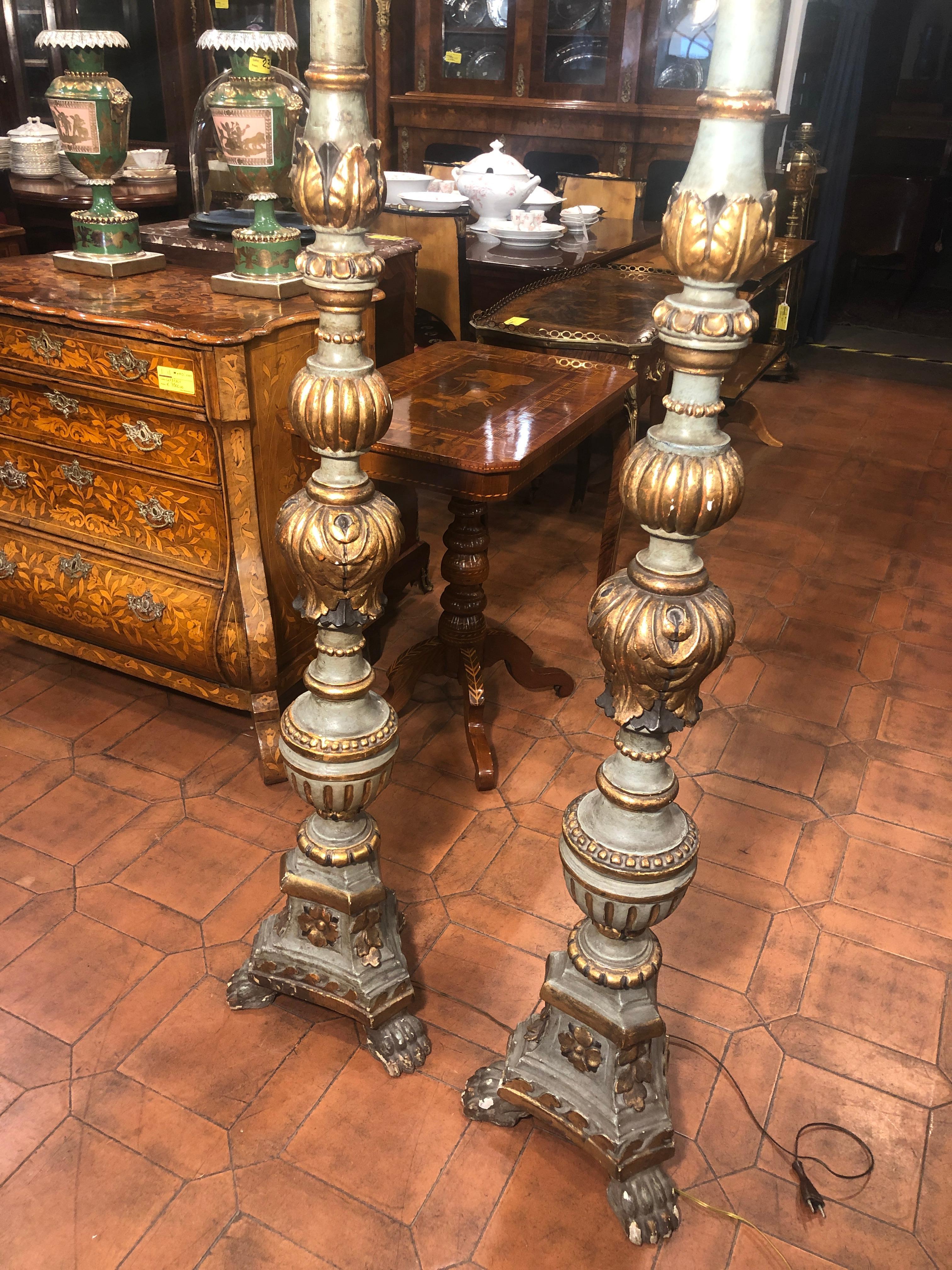 Pair of Venetian torches, lacquered and gilded, were electrified at a later date, the second half of the nineteenth century. In excellent structural aesthetic condition. A fine example of Veneto woodworking activity, in the execution of turnings.