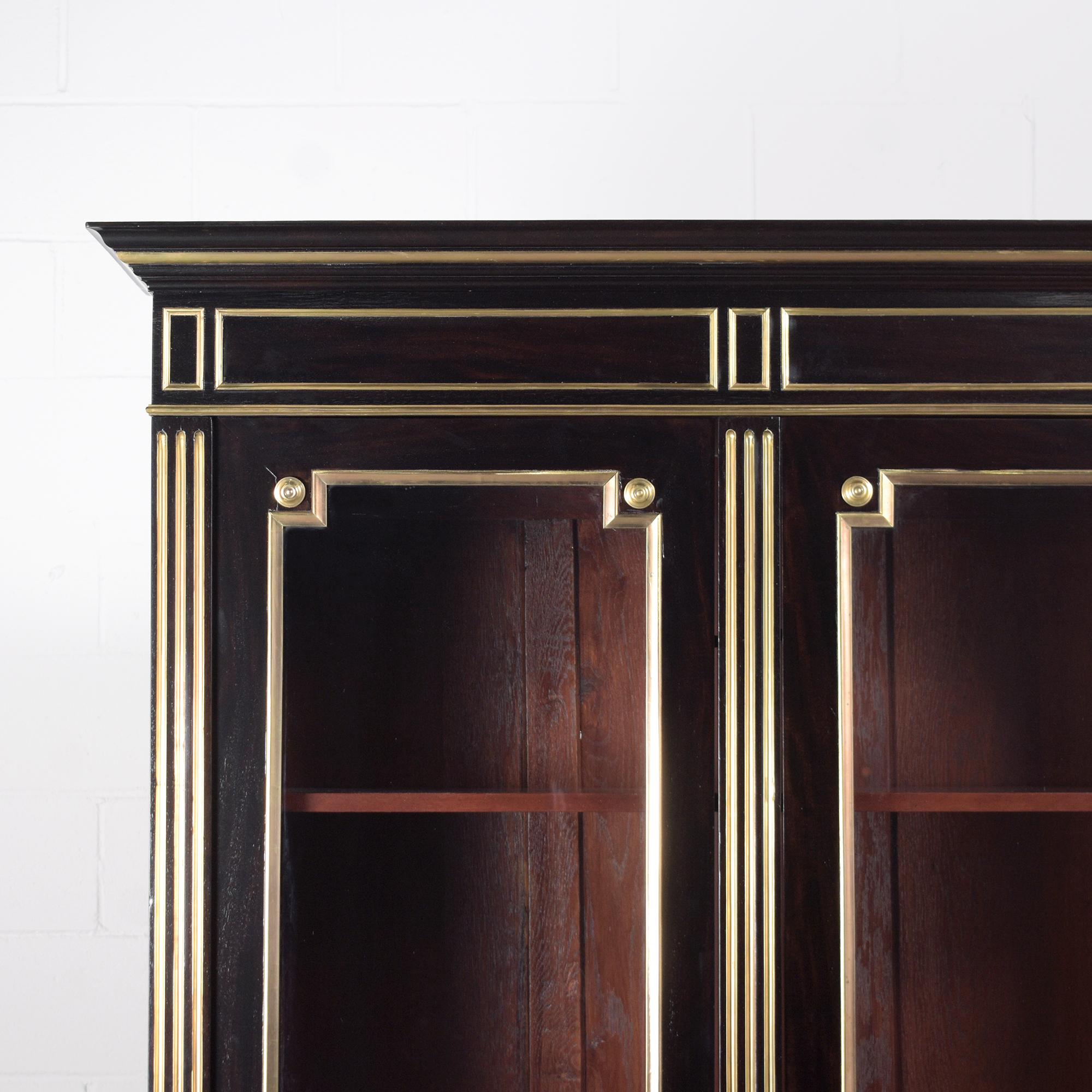 French 1870s Antique Louis XVI Mahogany Bookcase with Brass Moldings and Glass Doors For Sale