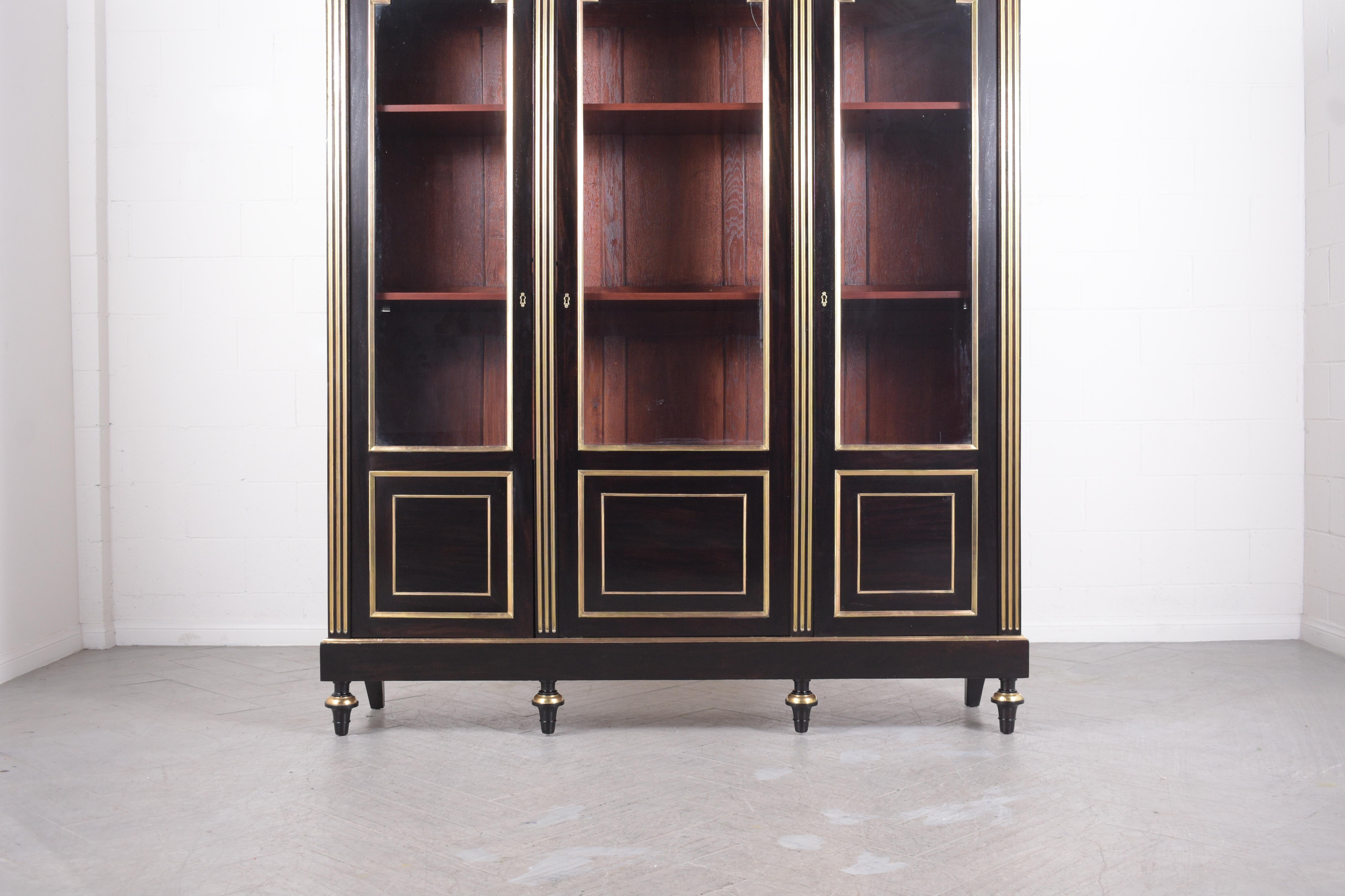 Plated 1870s Antique Louis XVI Mahogany Bookcase with Brass Moldings and Glass Doors For Sale