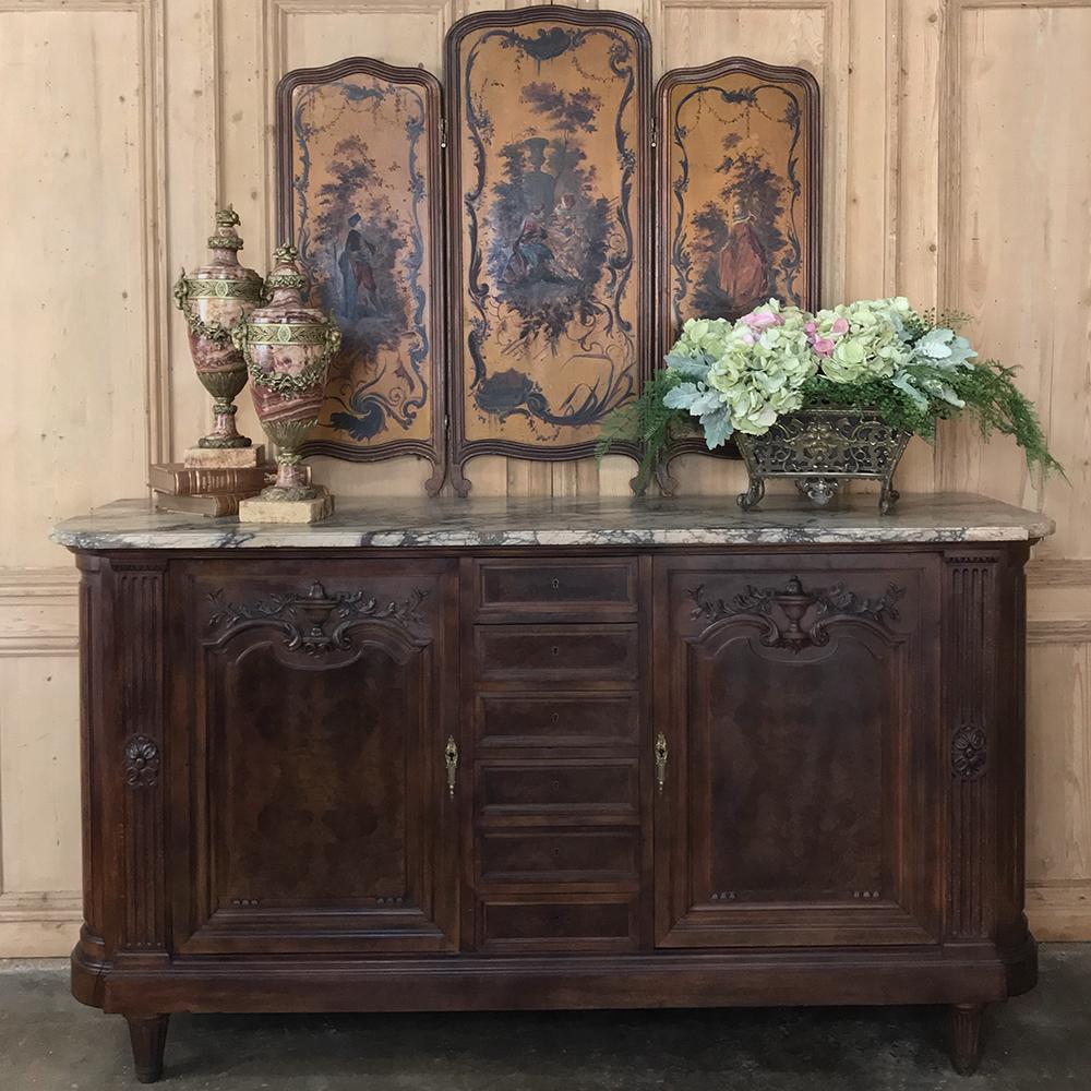 19th century Louis XVI burl walnut marble top buffet by Mercier of Paris
This stunning buffet handcrafted by Mercier and Freres, one of the premier Parisienne furniture crafters during the Belle Époque, is a marvel of artistic expression in both