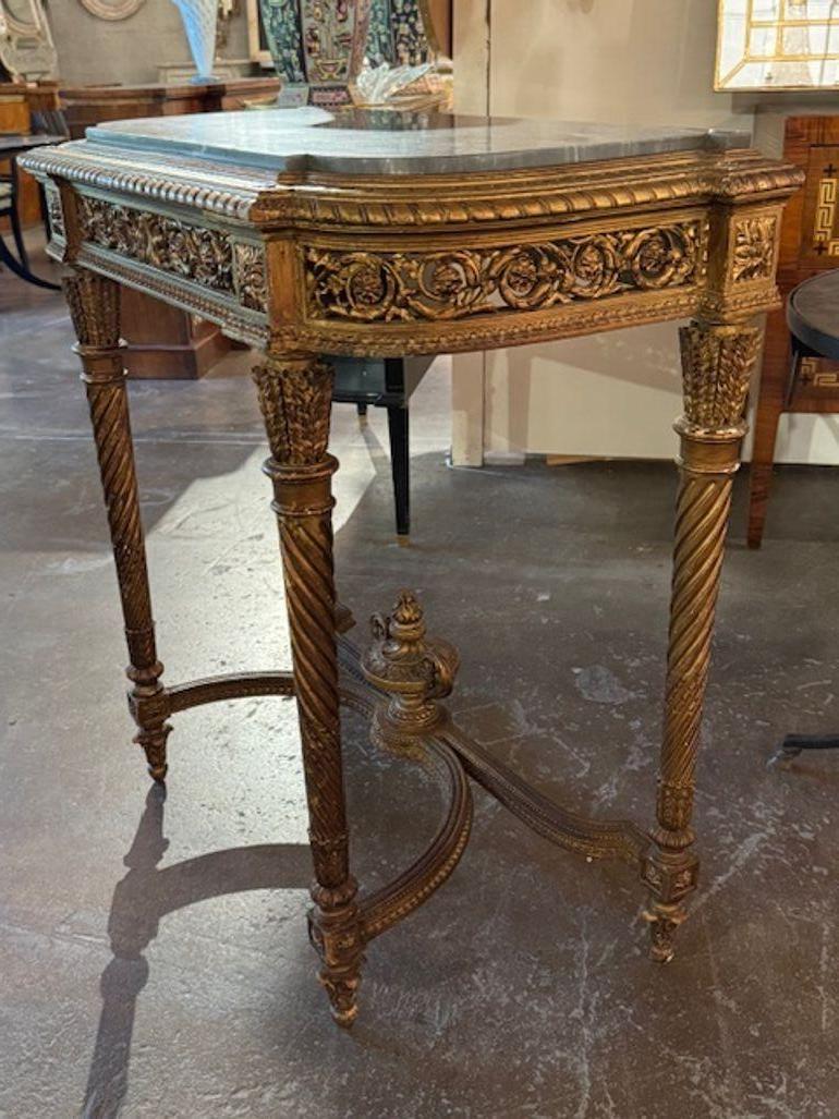 This product is a beautiful French  19th Century Louis XVI carved and giltwood console with a marble top, perfect for adding a touch of elegance to any home. The intricate carvings and the beautiful patina make it a stunning piece of furniture. 