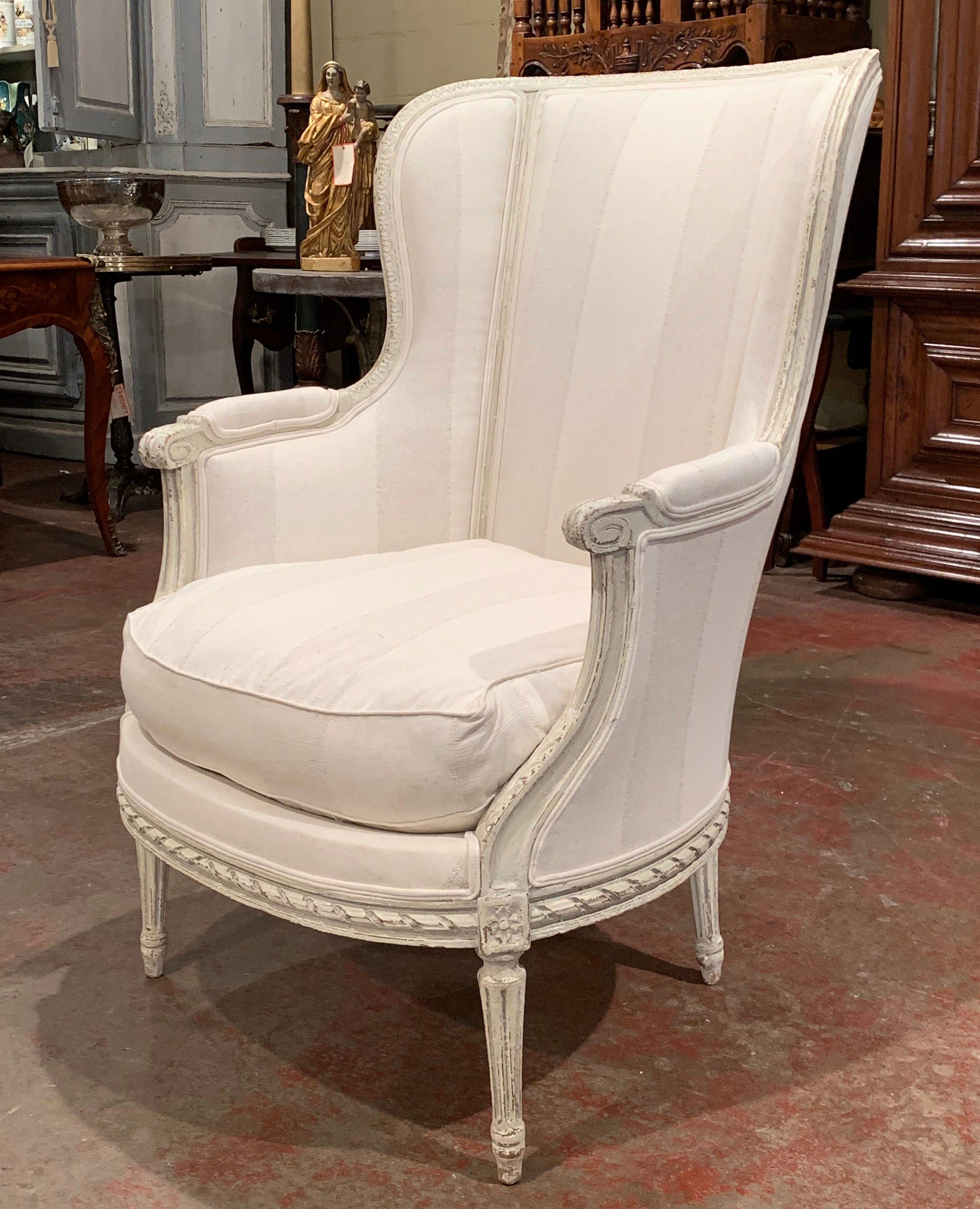 French 19th Century Louis XVI Carved Painted Bergère Armchair with Striped Fabric